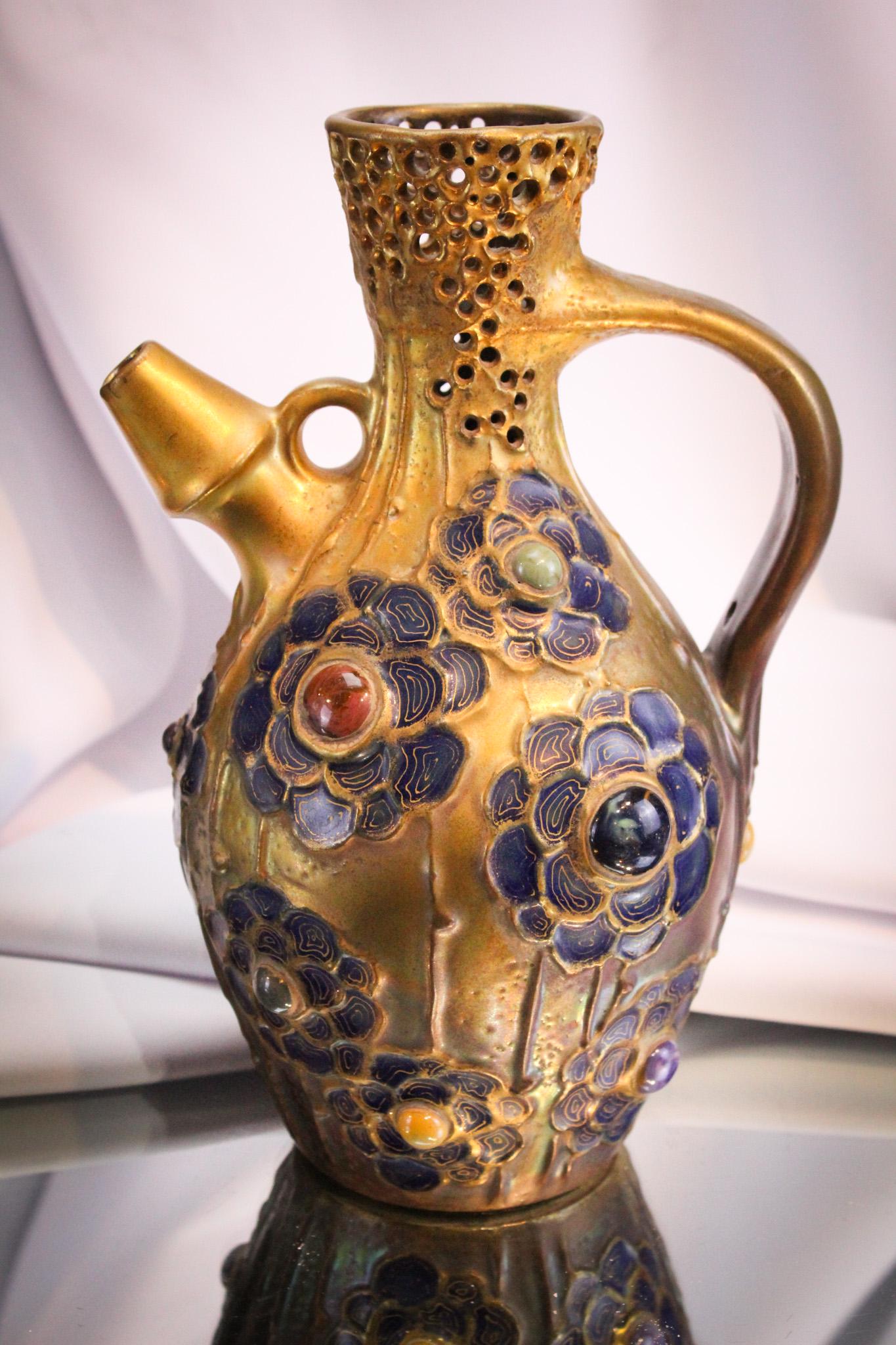 10" Amphora Art Nouveau Jeweled Ewer: Incredible Art Nouveau Amphora porcelain Jeweled ewer. Piece has pierced top. Prime example and measures a large 10" tall. Fine piece.