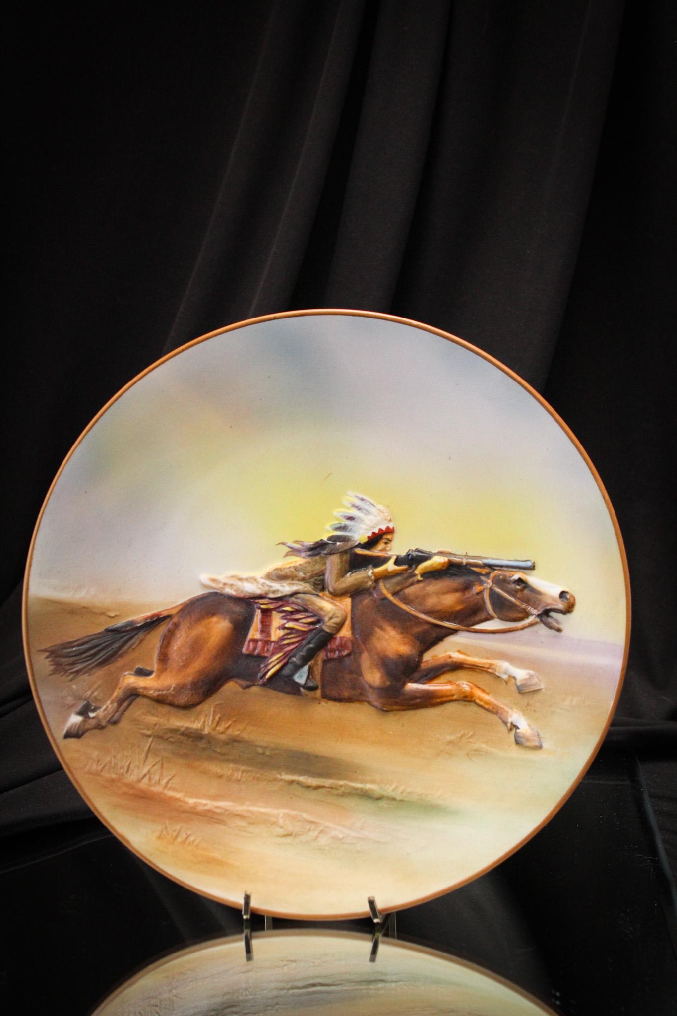 Nippon Blown Out Indians on Horseback Green Mark Plate: Fine piece here, folks! Rich colors embellish this lovely blown out plate. One of the best examples we have had! Measures 10 1/2" in diameter.