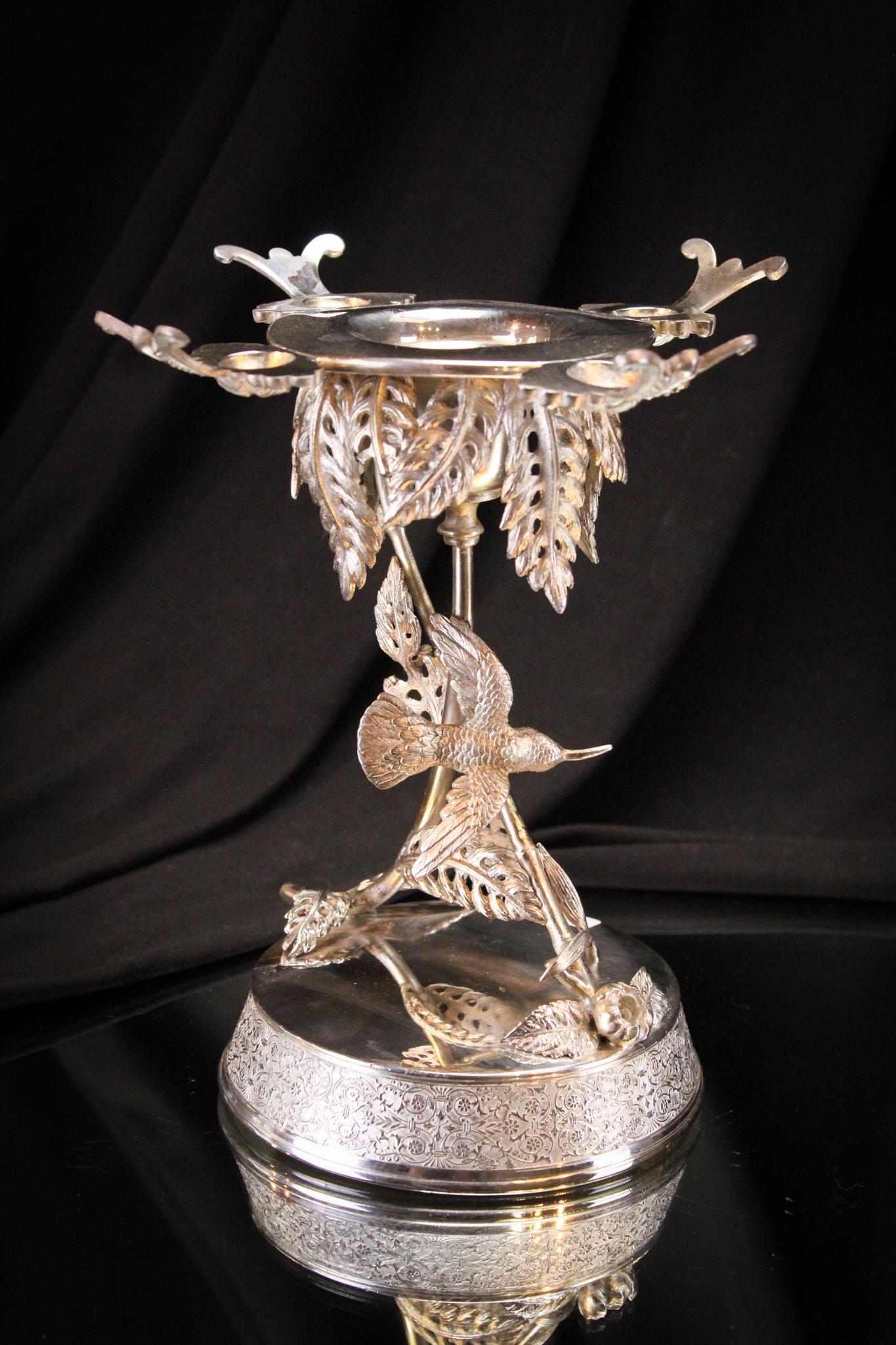 Meriden Silverplate Victorian Figural Hummingbird Brides Bowl Holder: Wonderful condition signed Meriden silverplate Victorian brides bowl holder. Holder features a full figure hummingbird. Measures 8 1/2" tall, 7 1/4" wide.
