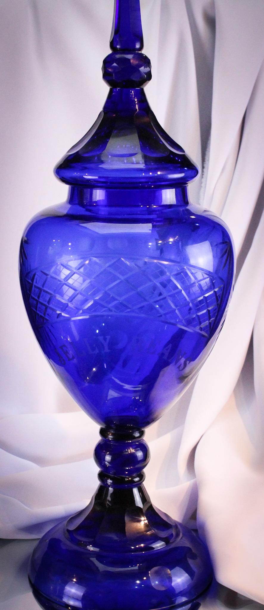 Monumental 25" Cobalt Cut Glass Jelly Beans Drug Store Container: This huge piece sure would be the eye catcher for anyone in the drug store. Huge piece measures 25 1/2" tall to the top of the lid. Piece is cut and engraved "Jelly Beans". Nice.