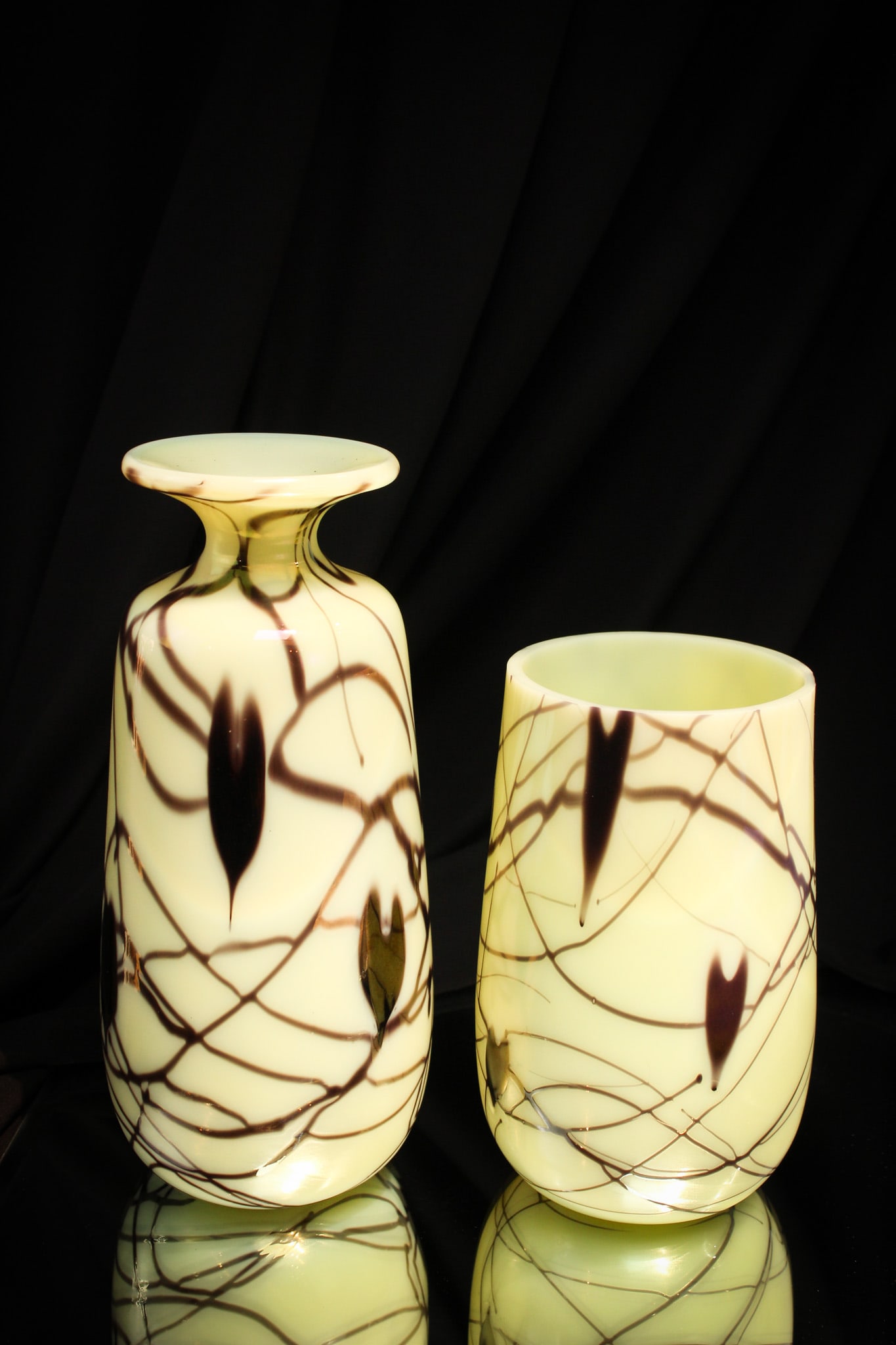 2 pc Lot Fenton Custard Hanging Heart Limited edition/Sample Vases: Select offering of two pieces of custard Fenton Hanging Heart pattern vases. One is a limited edition example signed "#118/600." The other is a sample. Nice.