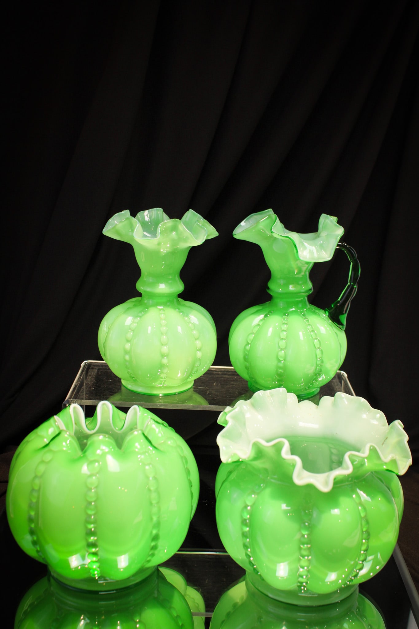 4 pc Lot Fenton Glass Green Overlay Beaded Melon: Selection of four fine example of banana leaf green Fenton glass Overlay Beaded Melon pattern comprised of 3 vases and one ewer.