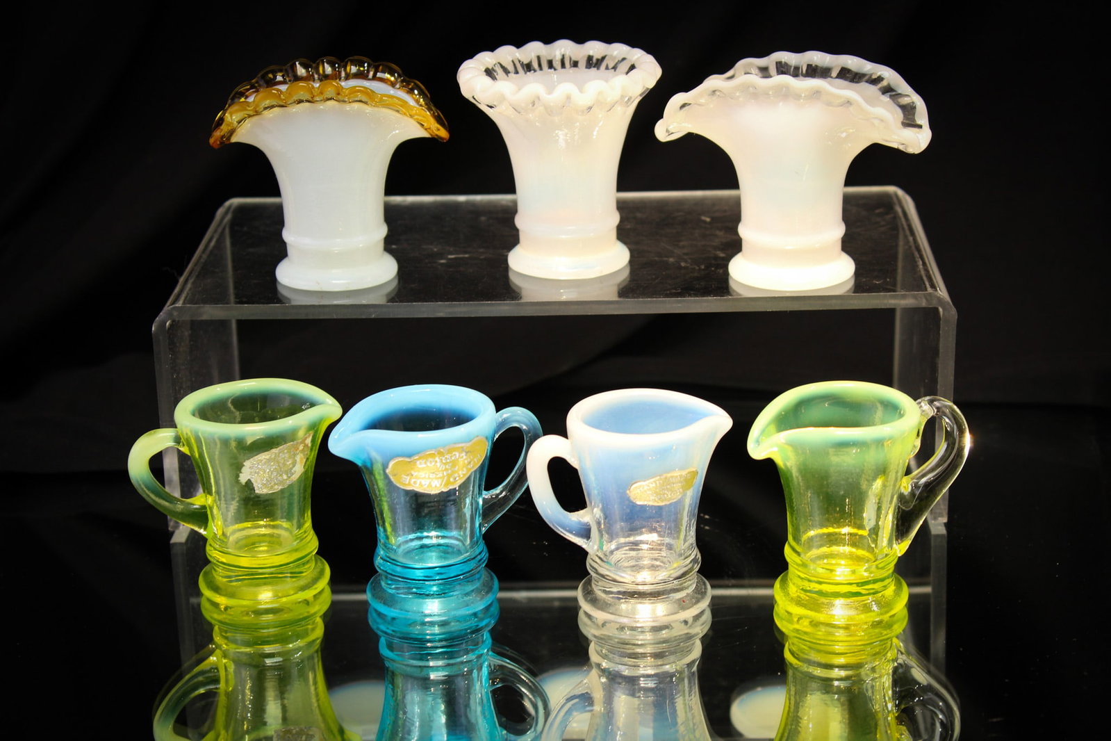 7 pc lot Fenton Art Glass Miniatures: Super assorted lot of Fenton art glass miniatures in pitchers and vases. Fine museum worthy examples in the whitest of white, vaseline that glows, crests, and opalescent. "Note the applied handle on o