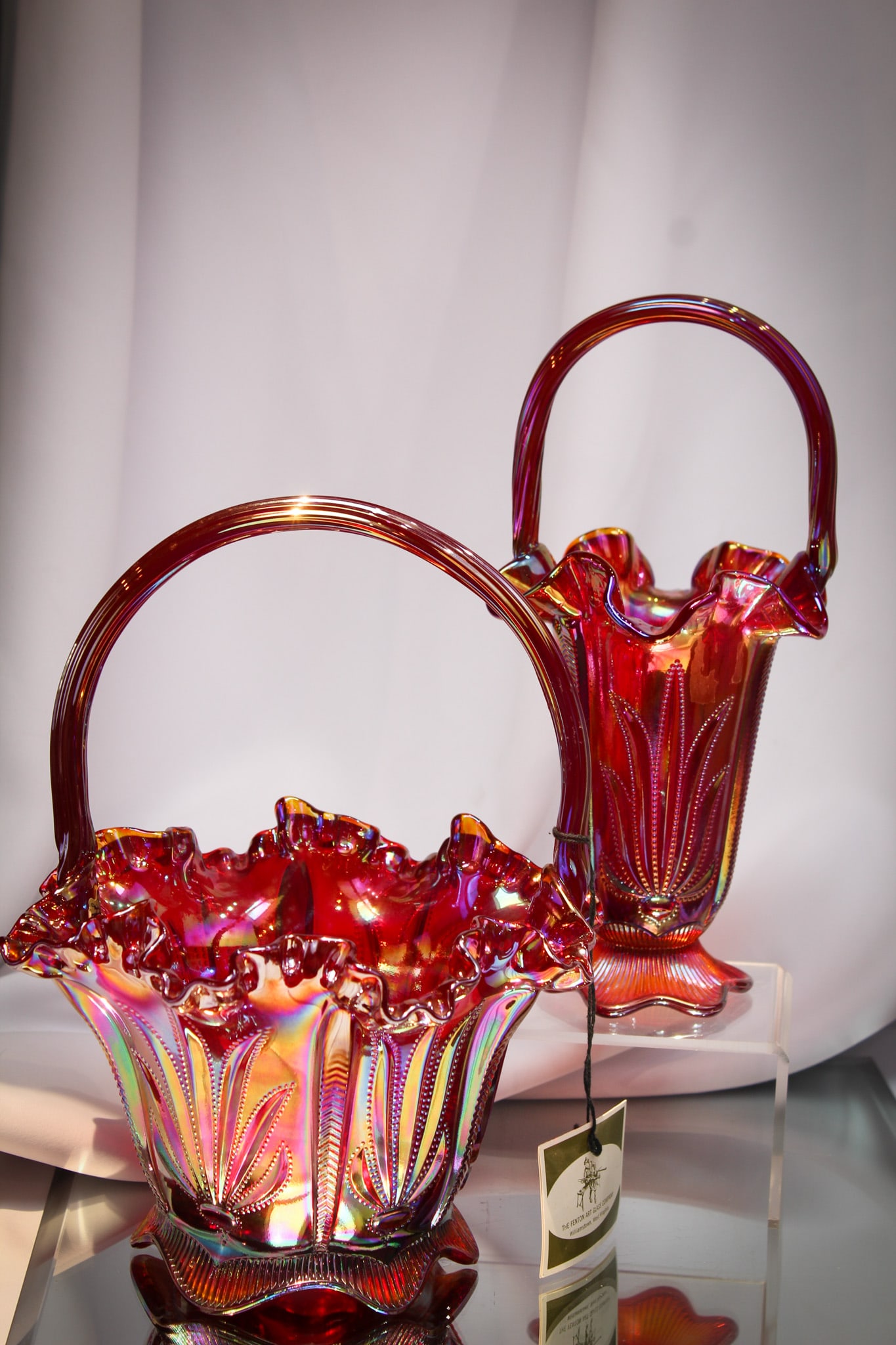 2 pc Lot Fenton Levay Red Carnival Glass Baskets: Select offering of two Fenton Levay red carnival glass "Cactus" pattern baskets.