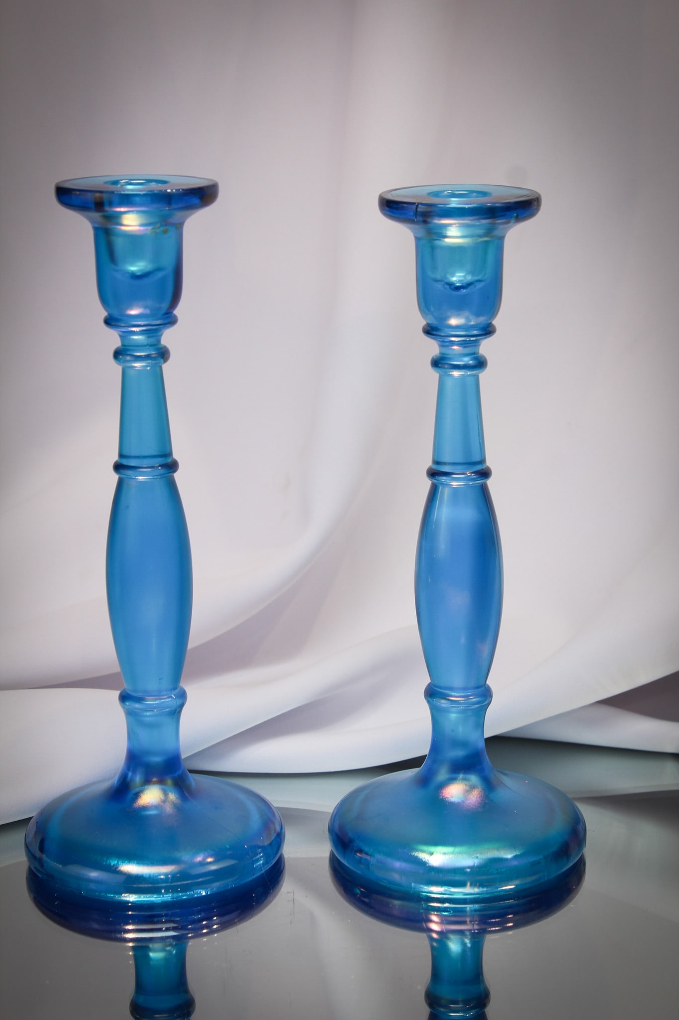 Fenton pair Art Glass #549 Celeste Stretch Blue Candlesticks: Two fine Celeste blue stretch Fenton glass candlesticks.