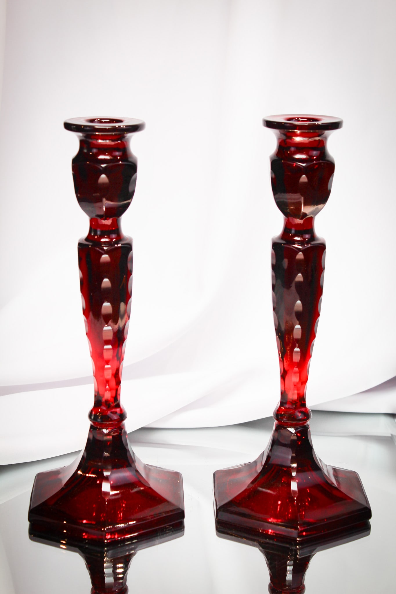 Fenton pair Ruby Cut Ovals #349 candlesticks: Rich pair of ruby Fenton #349 cut ovals candlesticks.