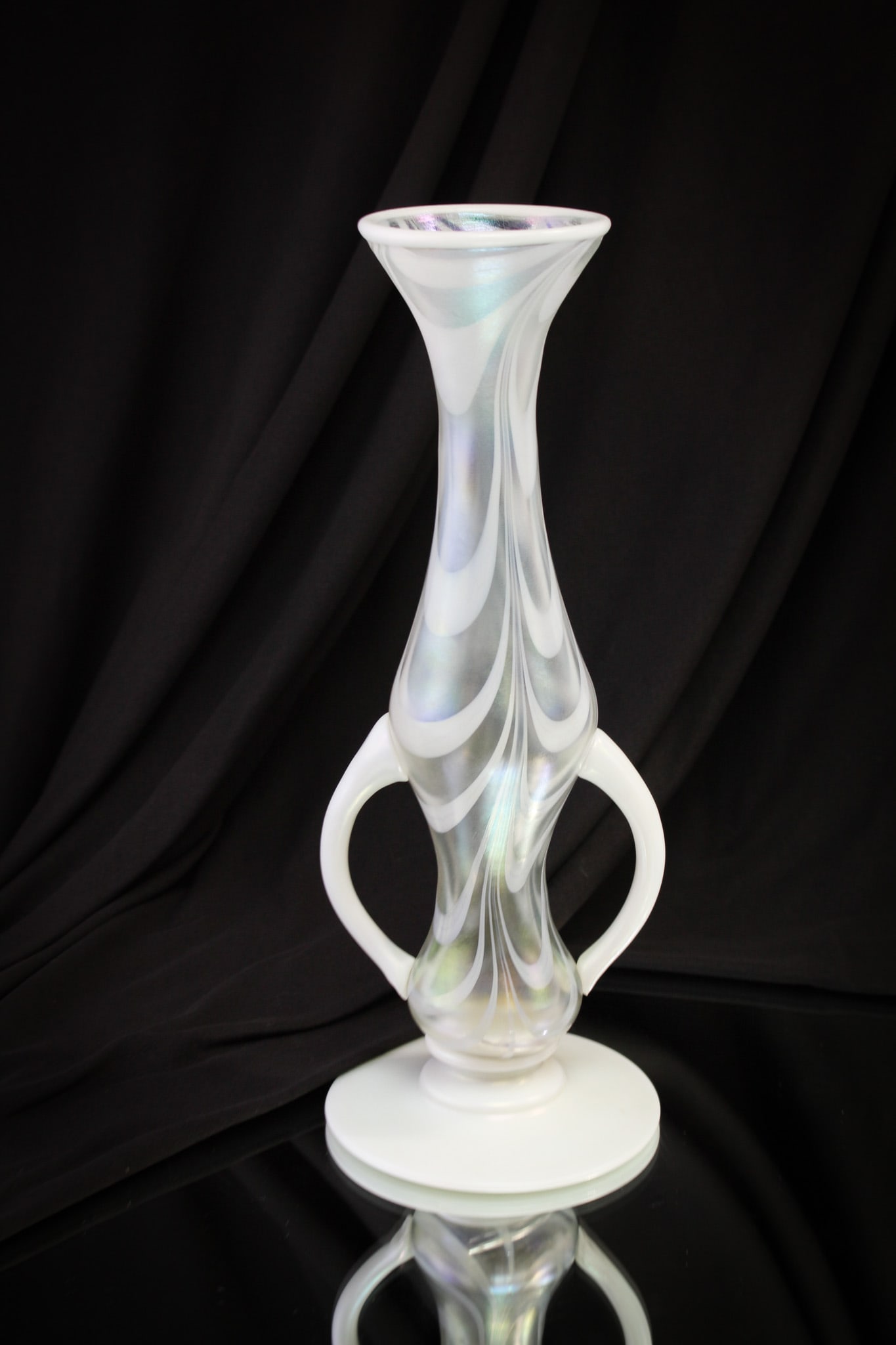 Imperial Freehand Glass Irridescent Drag Loop: Nice and big, just how you like them. This monster of a vase measures 11 1/4" tall. Beautiful white irridescent drag loop handled vase with applied foot.