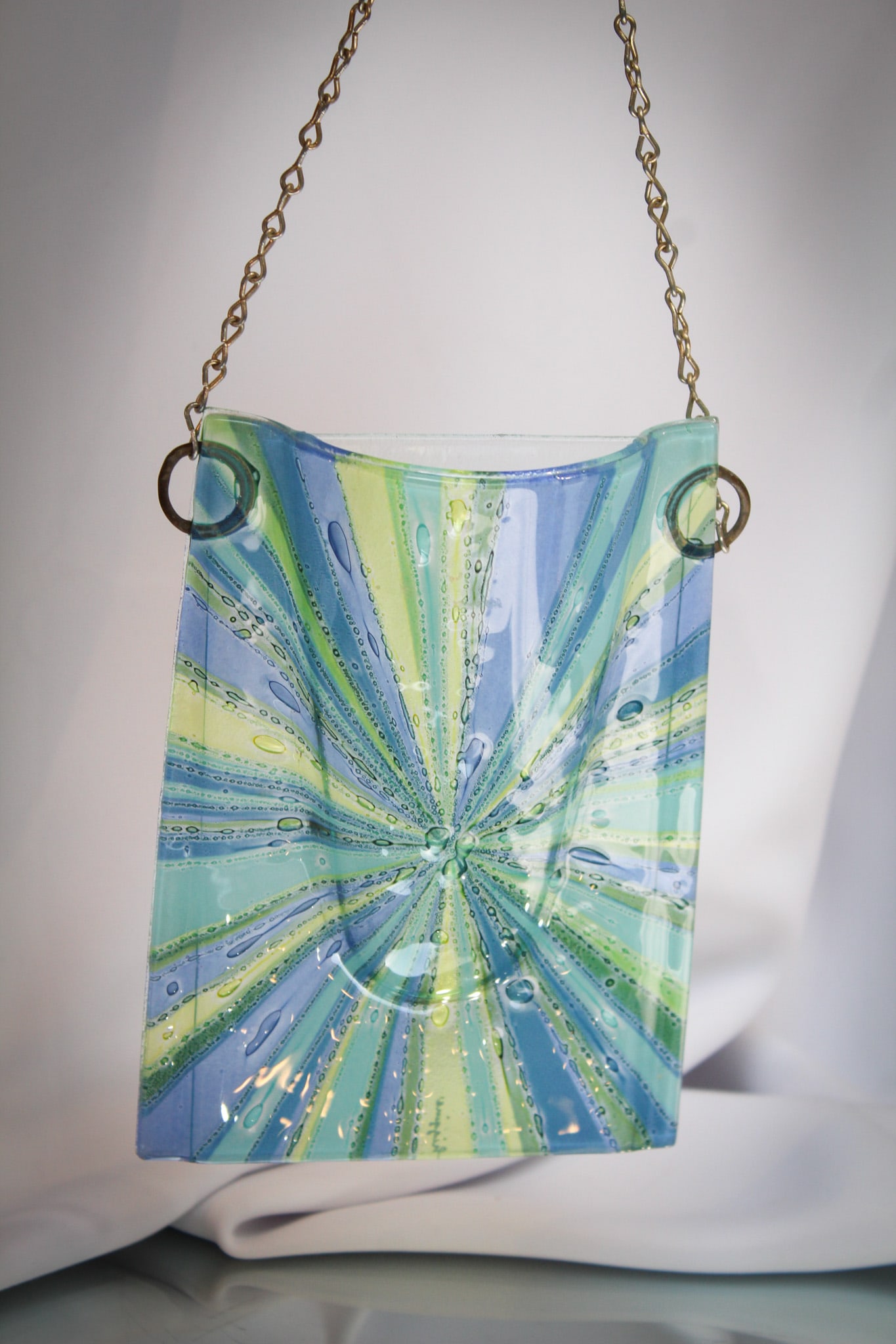 Signed Higgins Art Glass Sunburst Wall Pocket: Great piece of Higgins art glass in the form of a hanging wall packet in a sunburst pattern. Complete and nice! Measures 5" by 7".