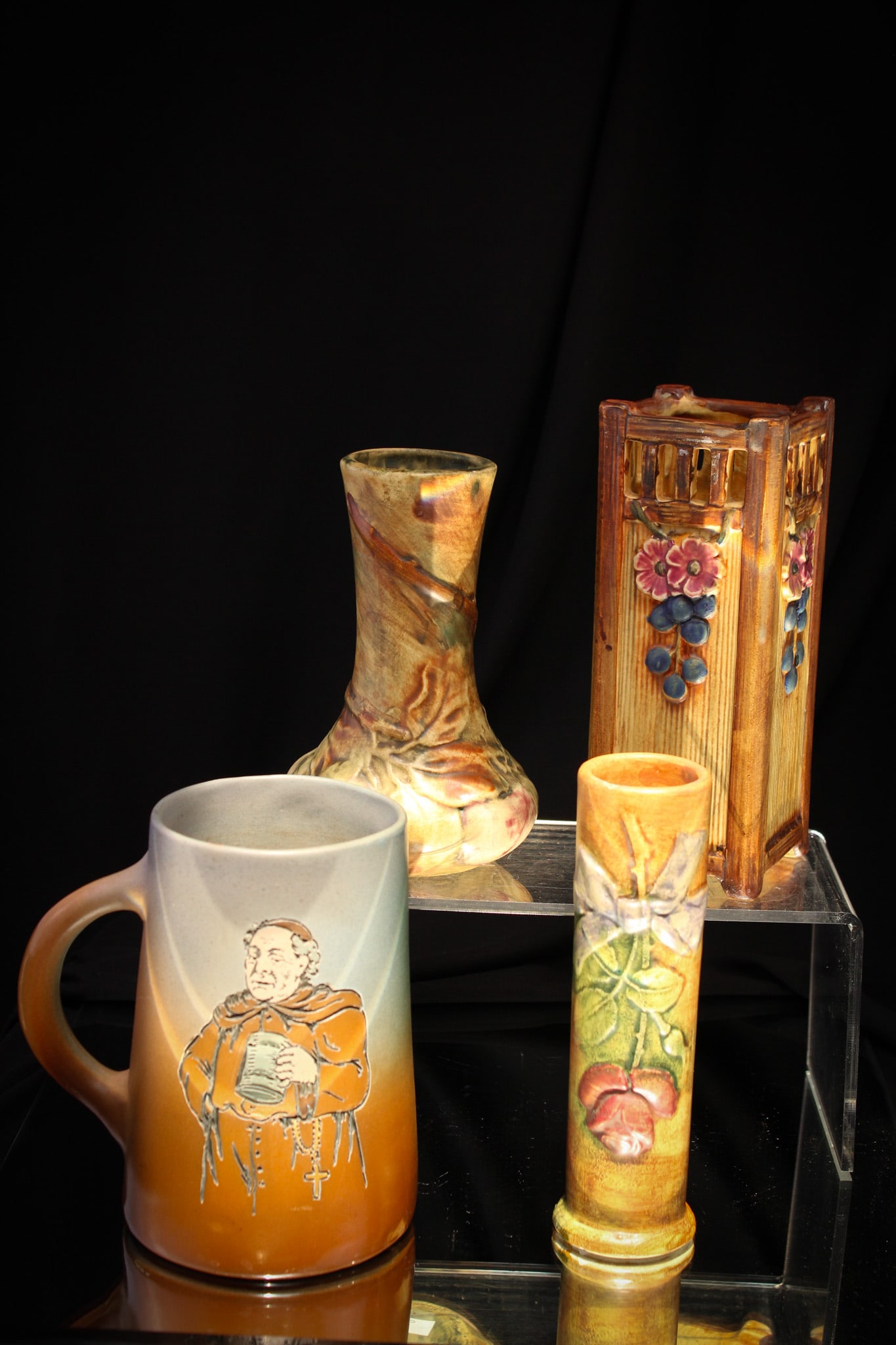 4 pc Lot Weller Pottery: Select lot of four pieces of Weller pottery including a Dickensware monk mug and three vases.