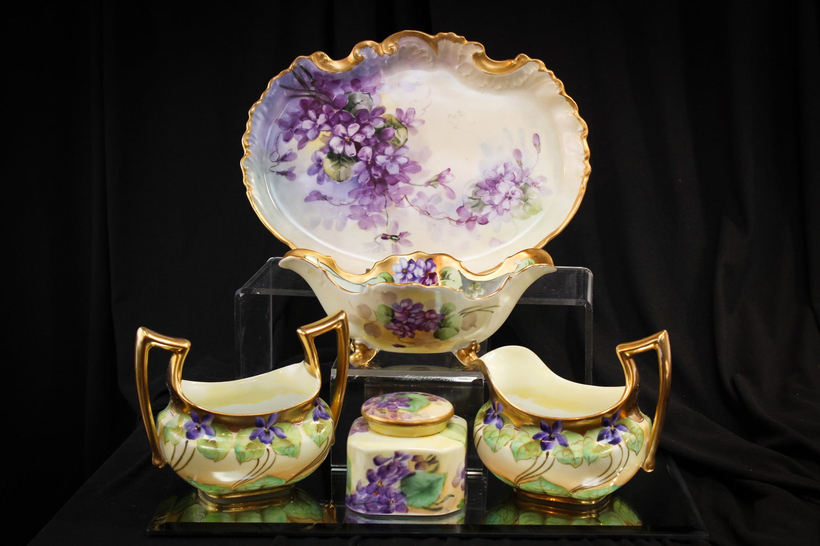 5 pc Lot Pickard & More Hand Painted Porcelain Violets: Nice assembled grouping of "Pickard" signed hand painted porcelain and more. Offered is a signed Pickard creamer and sugar with double handles. Another signed Pickard ovoid footed bowl. A French porce