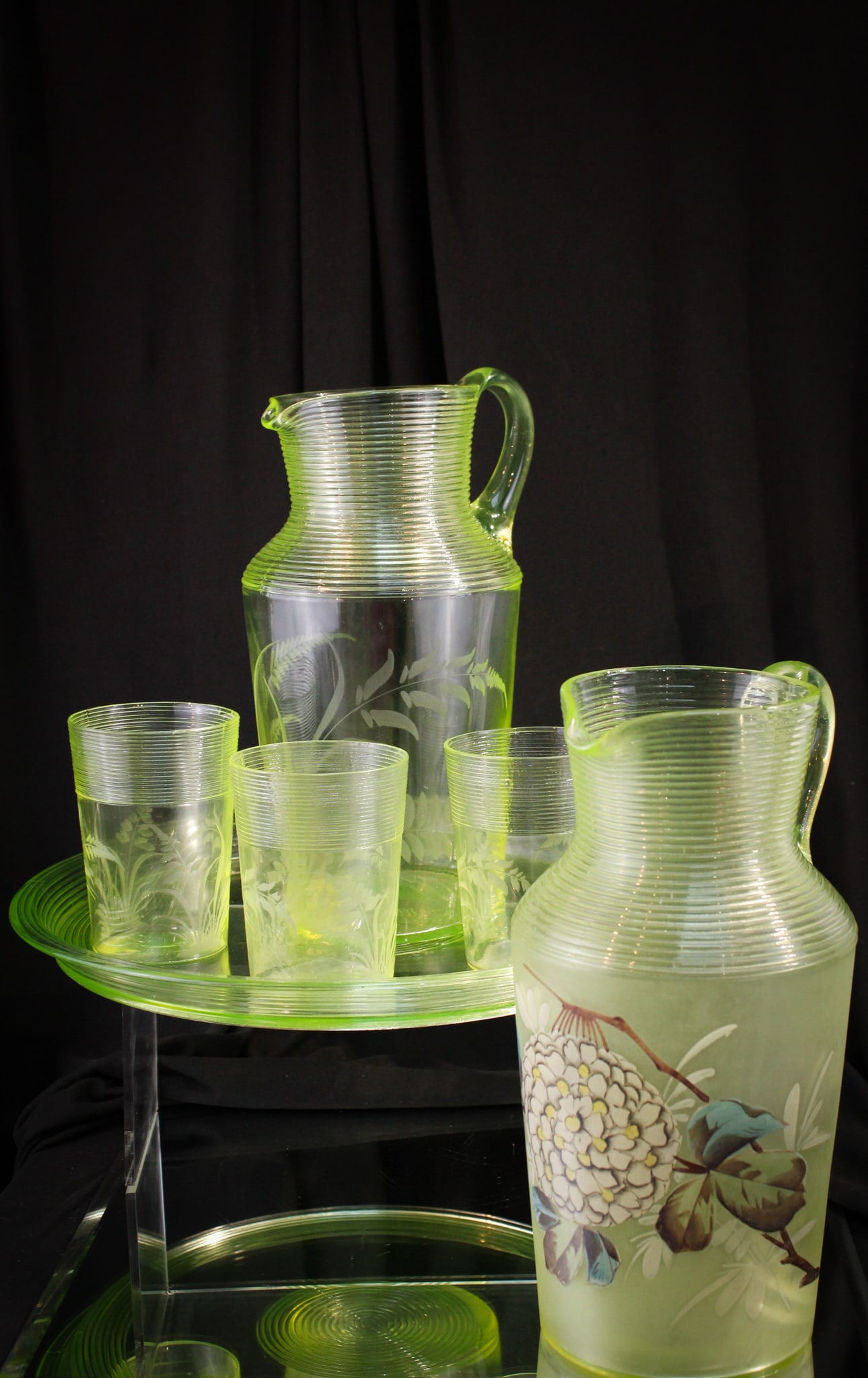 6 pc Lot Vaseline Threaded Victorian Glass Water Set & More: Great offering of an undecorated Vaseline threaded pitcher, tray, and three tumblers all engraved combined with the same pattern pitcher but enamel decorated.