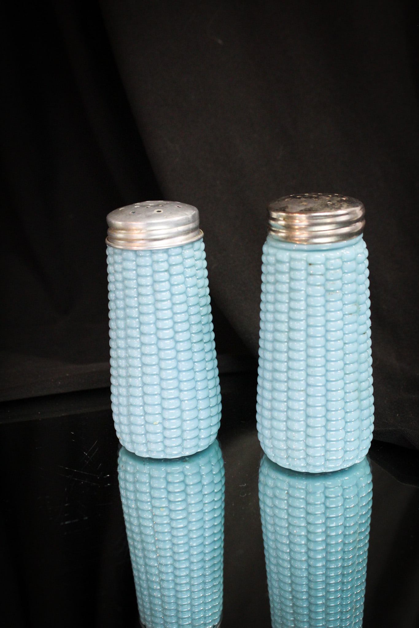 Pr. Dithridge Blue Milk Glass Corn Victorian Salt Shakers: Always a find for the astute corn cob collector. This lovely pair of Victorian era salt shakers is in blue milk glass. Nice well defined bumpy kernel pattern up and down the tapered sides. Sure to ple