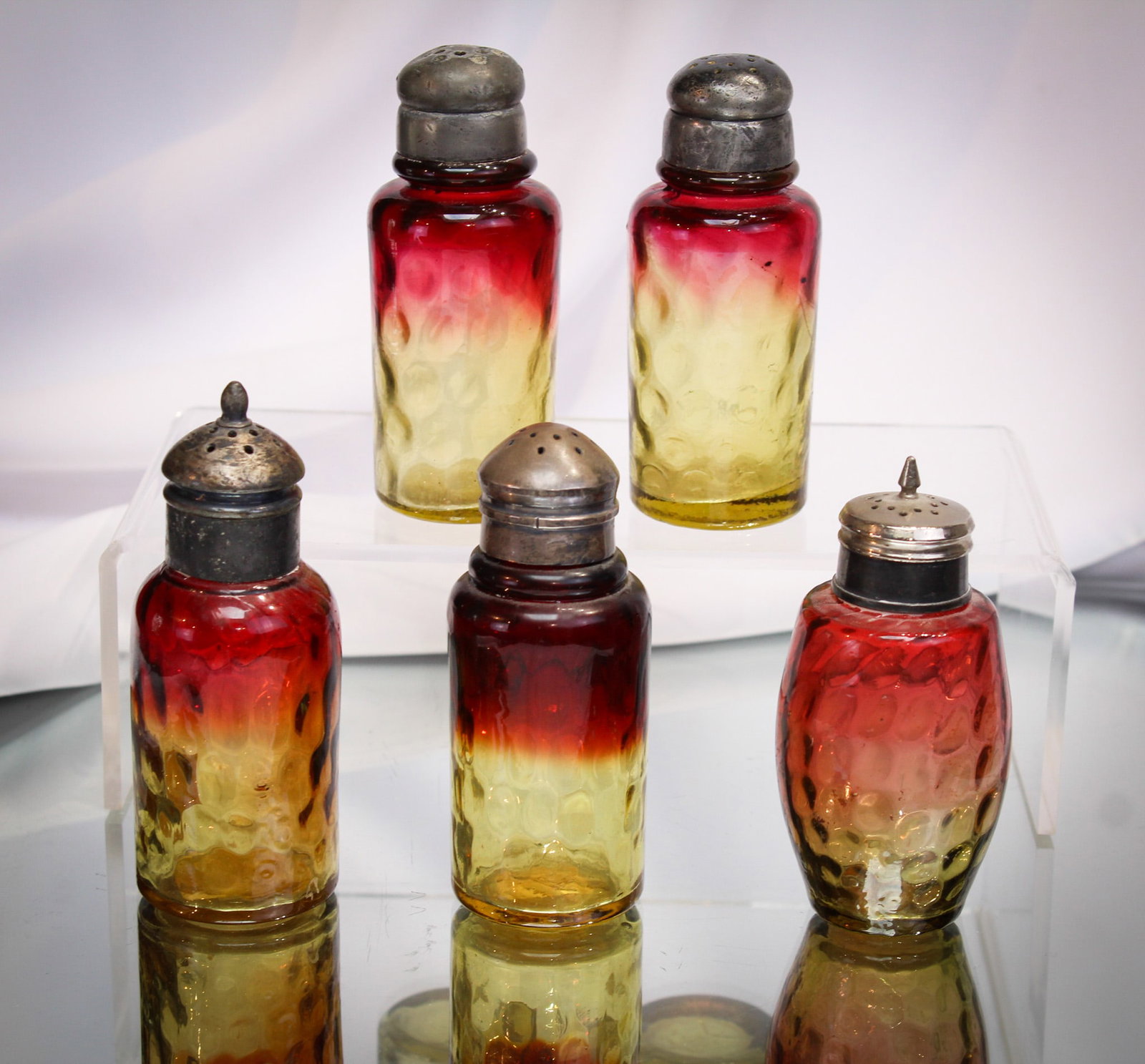 5 pc Lot Amberina Victorian Glass Salt Shakers: Nice array of Victorian amberina salt shakers. Each with a little variation in coloring or pattern. Go find five at one time! We dare you!