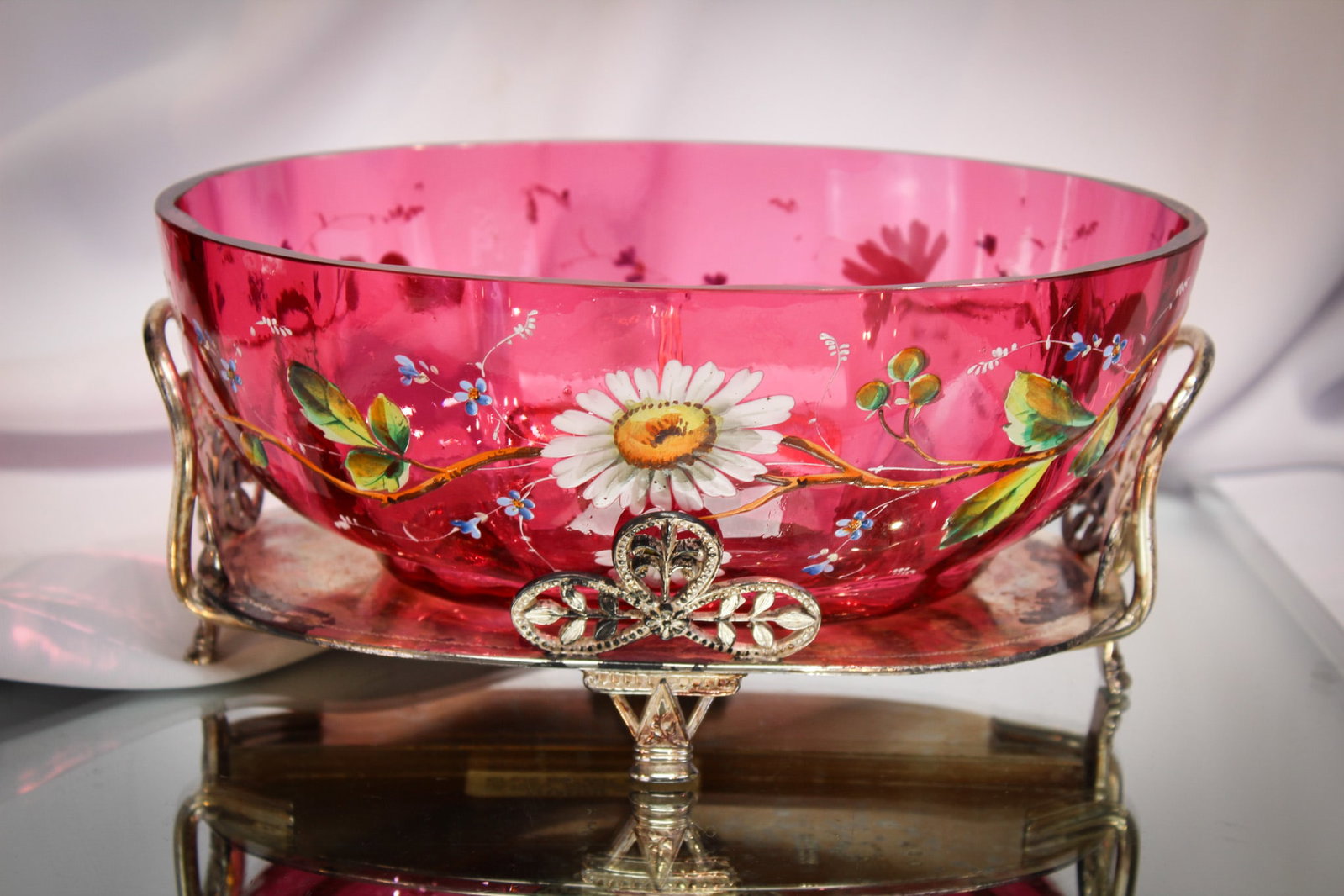 Aurora Silverplate Cranberry Enameled Victorian Brides Bowl: Beautiful cranberry optic ribbed enameled oval brides bowl set in original signed "Aurora" silverplate frame. Bowl is decorated with a profusion of daisies and more. Measures 4" tall, 9" wide.