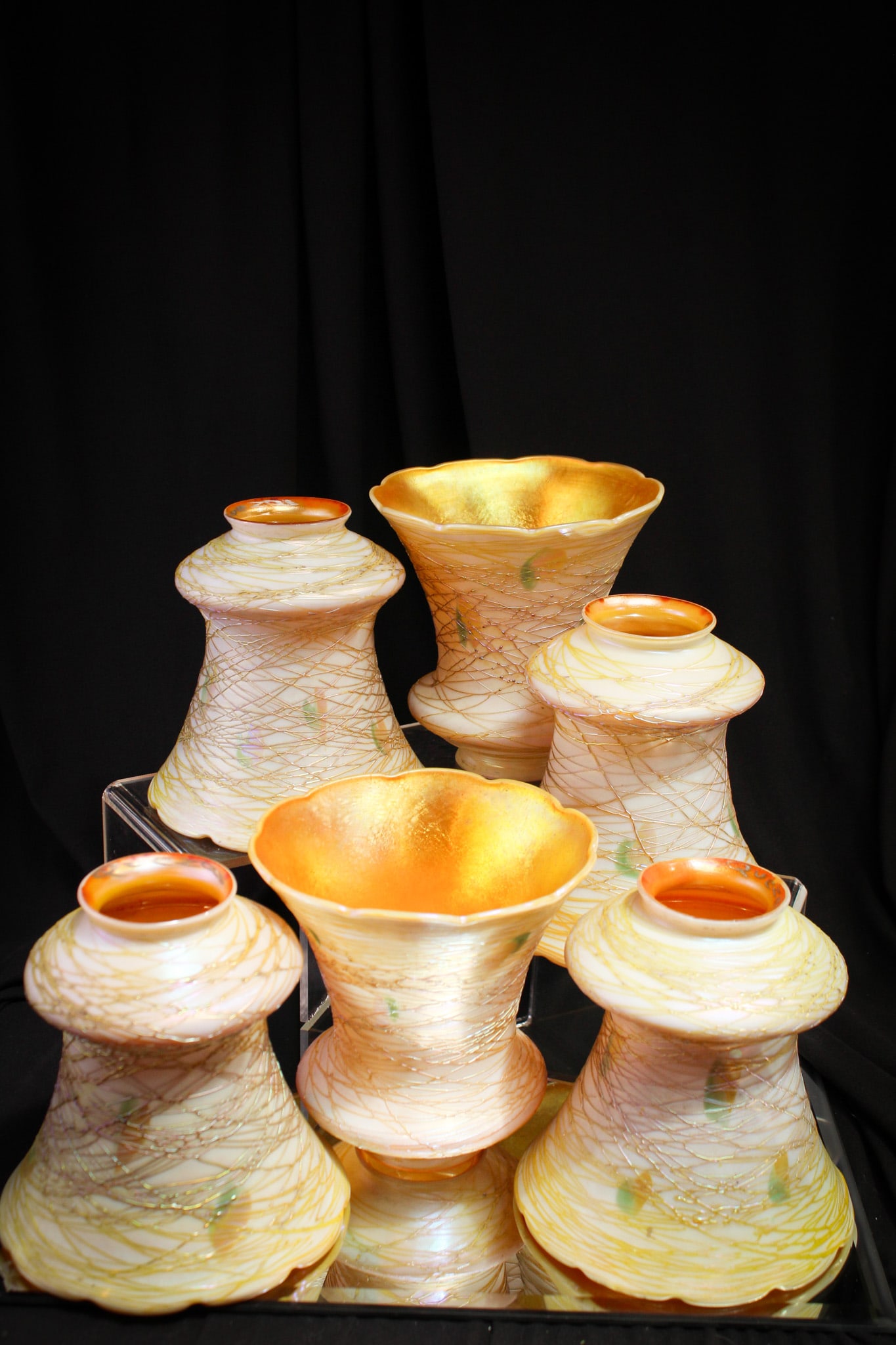 Set 6 signed Quezal Threaded irridescent Art Glass Shades: Super offering of a complete set of 6 signed Quezal antique threaded art glass shades with green/orange gold hearts and abundant threading. Beautiful set! Each shade has a 2 1/8" fitter rim and stands