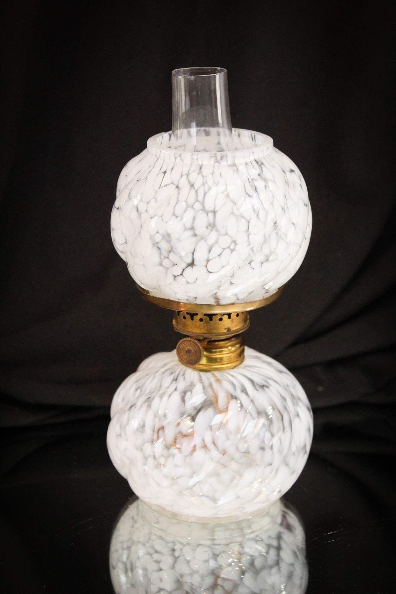 Northwood Parian Swirl Spatter Miniature Victorian Oil Lamp: Nice find here in this super example of a hard to find miniature lamp by Northwood. This one is the "Parian Swirl" mold with white spatter effect to the glass. Complete and original!