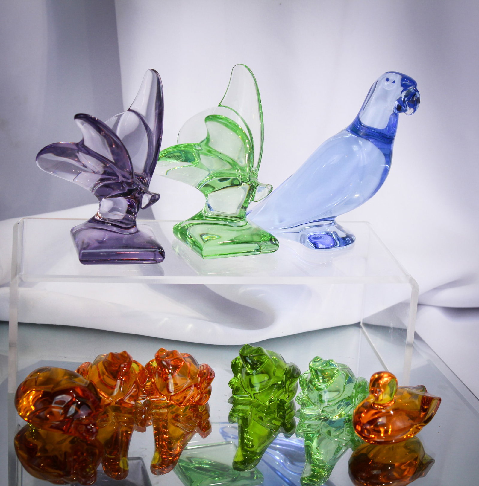 9 pc Lot Baccarat France Art Glass Animal Figurines: Select offering of nine wonderful "Baccarat" signed critters. Lot is comprised by 2 butterflies,1 parrot, 4 frogs, 1 duck and a turtle.