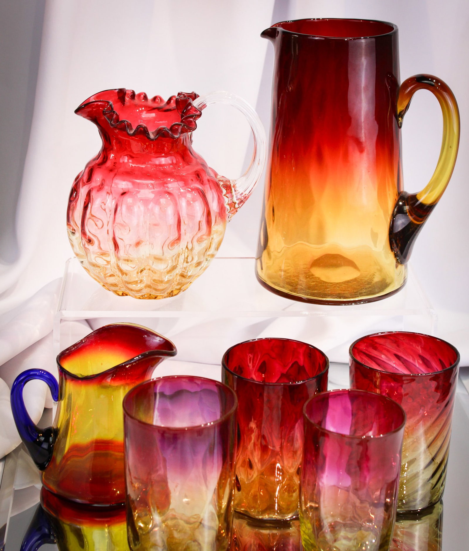 7 pc Lot Amberina Mt. Washington Fenton Glass: What an offering we have here folks! Great selection including a diamond quilt pitcher, an attributed to Phoenix lobed creamer, four tumblers possibly by Mt. Washington or New England, and completed b