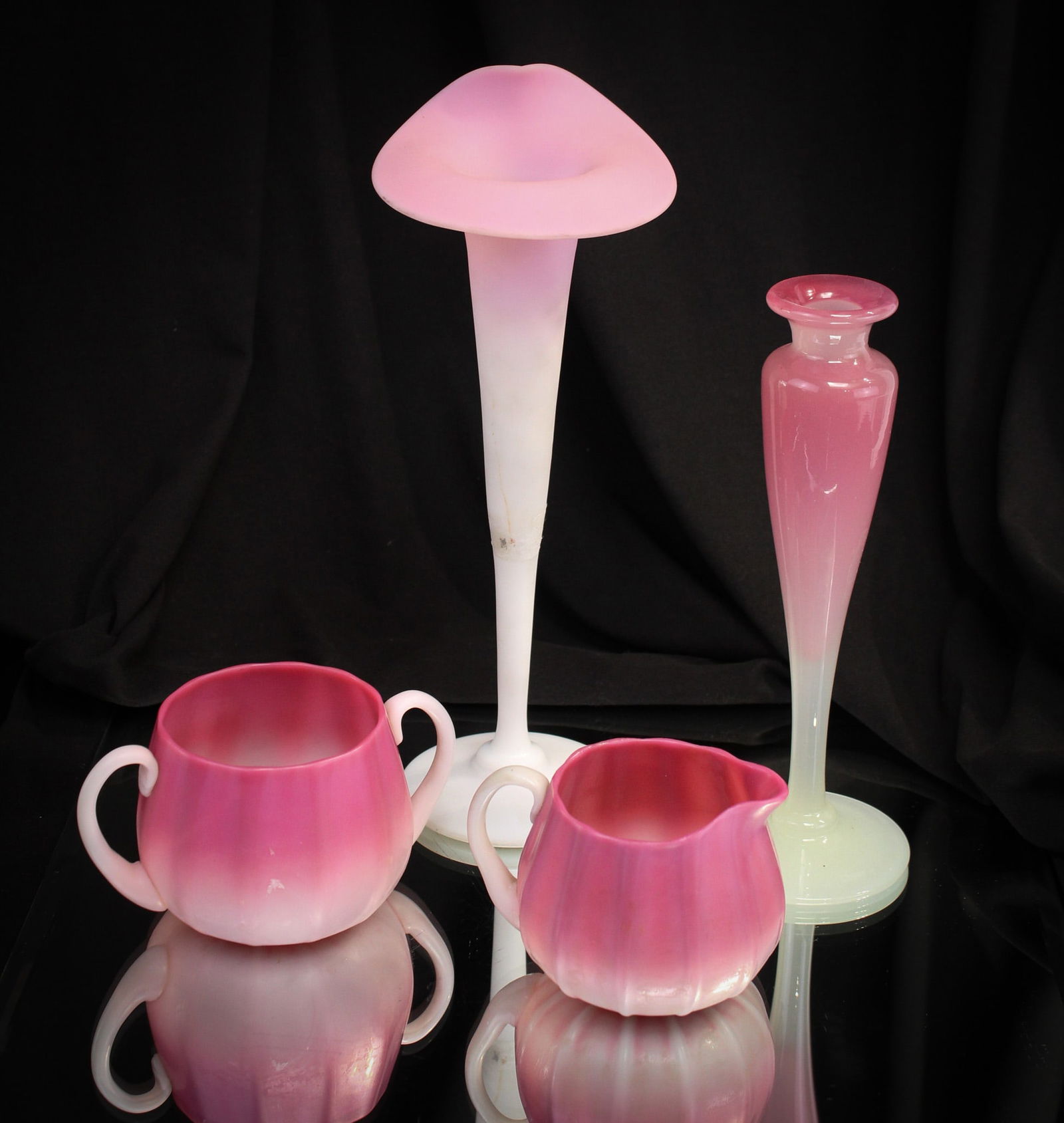 4 pc Lot Peachblow Steuben & More Glass: Straight out of an old man we have pulled this collection together to include a peachblow New England glass creamer and sugar bowl, a jack in the Pulpit lily vase, and completed by a Steuben Rosalene