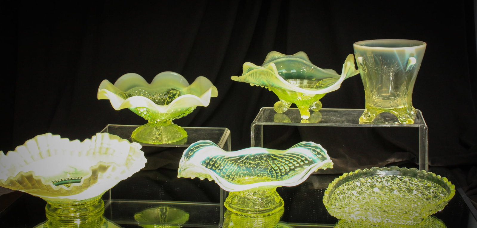 6 pc Lot Victorian Vaseline Glass Opalescent & More: A super offering of six fine pieces of vaseline glass. All are opalescent with the exception of one. Lot is comprised of four bowls, one spooner, and an unusual "Daisy & Button" tray.