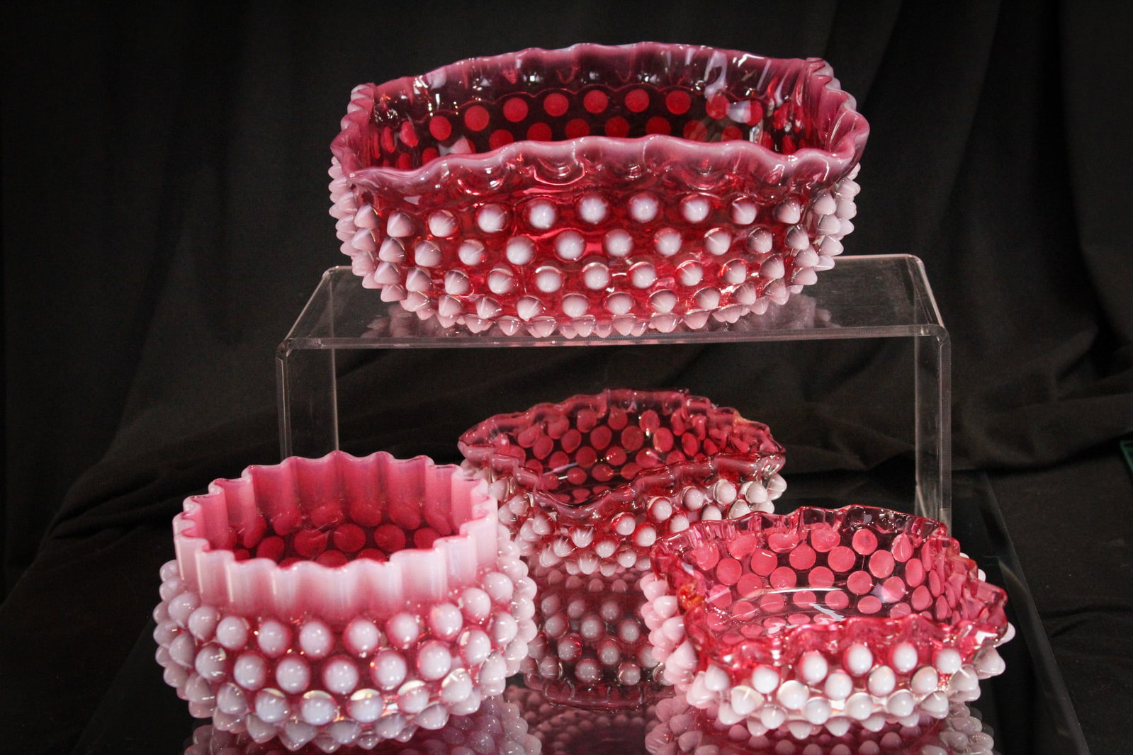 4 pc Lot Hobb's Cranberry Opalescent Victorian Glass Bowls: Nice assortment of four Hobb's Victorian cranberry opalescent bowls. Lot is comprised of a master berry bowl, a finger bowl, and two individual berry bowls. Largest measures 3" by 8".