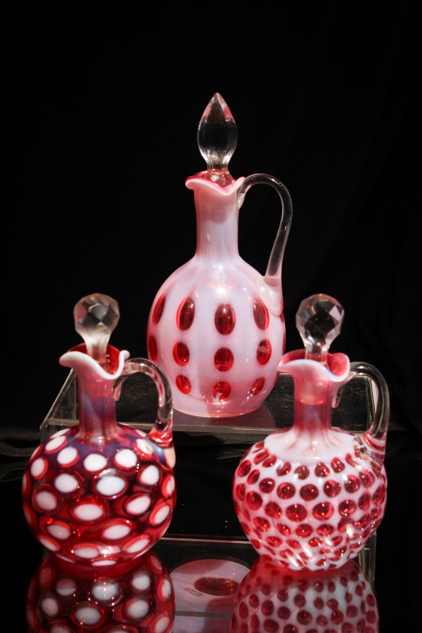 3 pc Lot Cranberry Opalescent Victorian Hobb's & More Glass Cruets: Perfect assembly of three Victorian cranberry opalescent cruets. Lot is comprised of a "Windows Swirled", "Polka Dot", and everyone's fan favorite "Coin Spot". Nice examples!