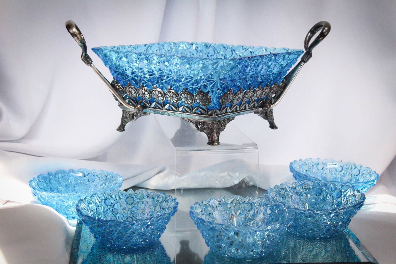 Meriden Silverplate Victorian Blue Daisy & Button Berry Set: Wonderful blue "Daisy & Button" pattern master berry bowl along with five individual berries complete in original signed "Meriden" silverplate holder for master bowl. Nice! Largest measures 6" tall by