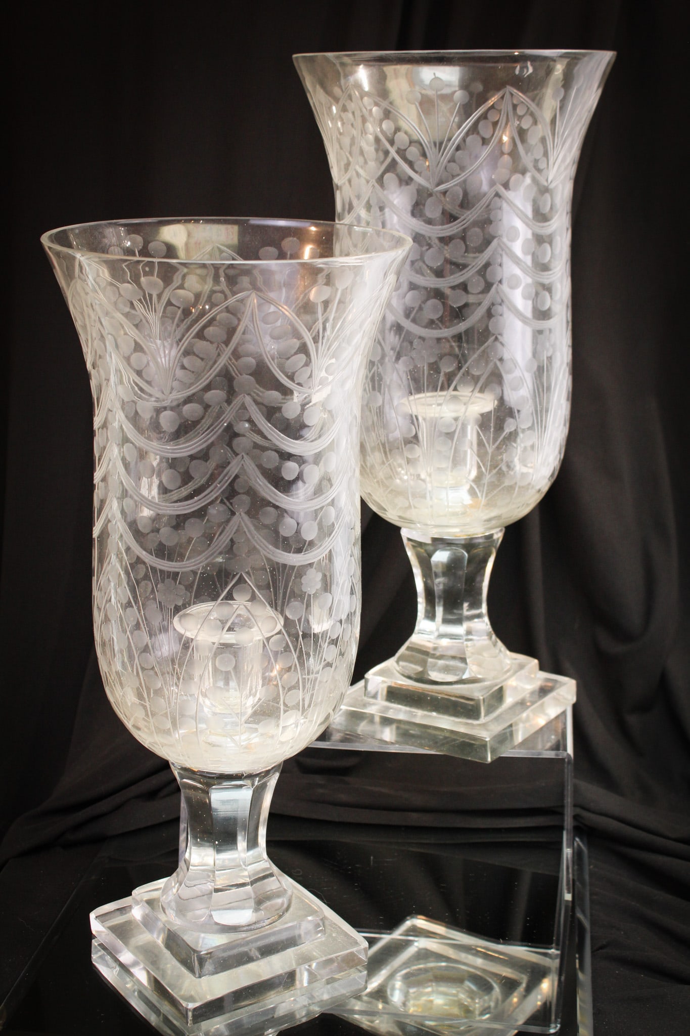 Pair Crystal etched Hurricane 16 1/2" Candle Lamps: If you're a size queen, then these are for you. Nice pair of engraved glass hurricane candle lamps. Each measures 16 1/2" tall.