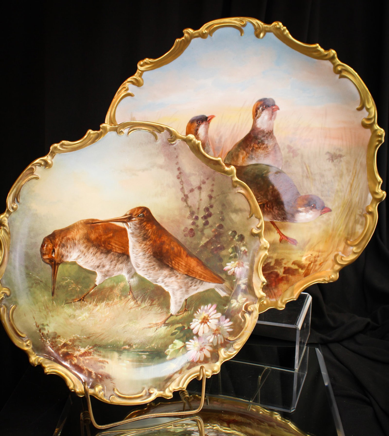 2 pc Lot Limoges France Hand Painted Porcelain Game Bird Chargers: Both signed "Dubois", these hand painted Limoges charges are stunning. One measures a whopping 15" in diameter. The other 13". Very elaborate.