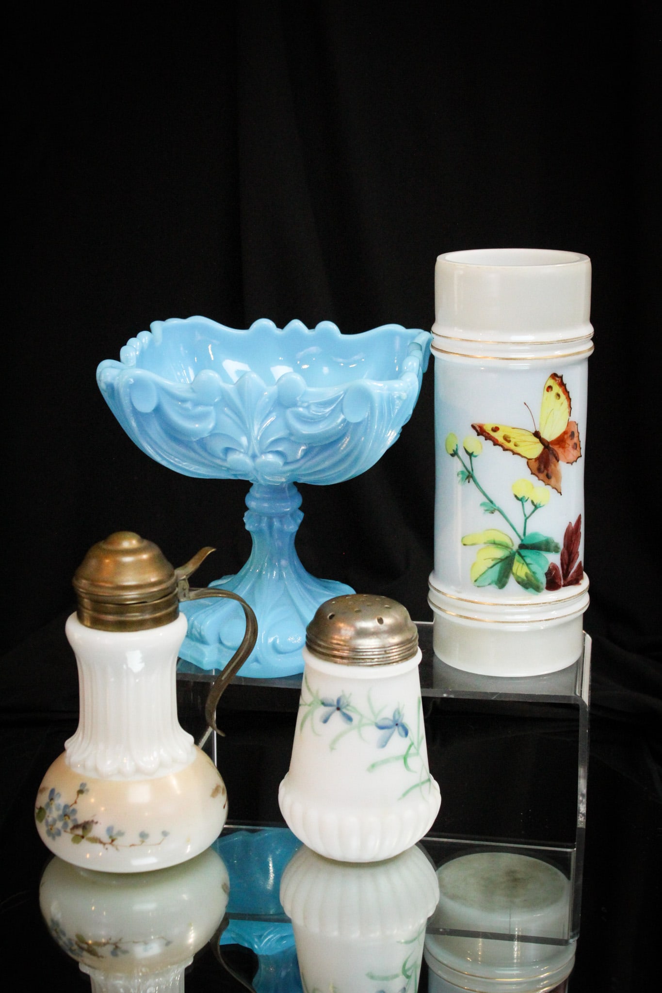 4 pc Lot Victorian Glass Smith Bros Wavecrest & More: Nice four piece lot of Victorian glass comprised by a Smith brothers decorated opal glass cylinder vase, a blue milk glass compote, and two Wavecrest items being a syrup and sugar shaker.