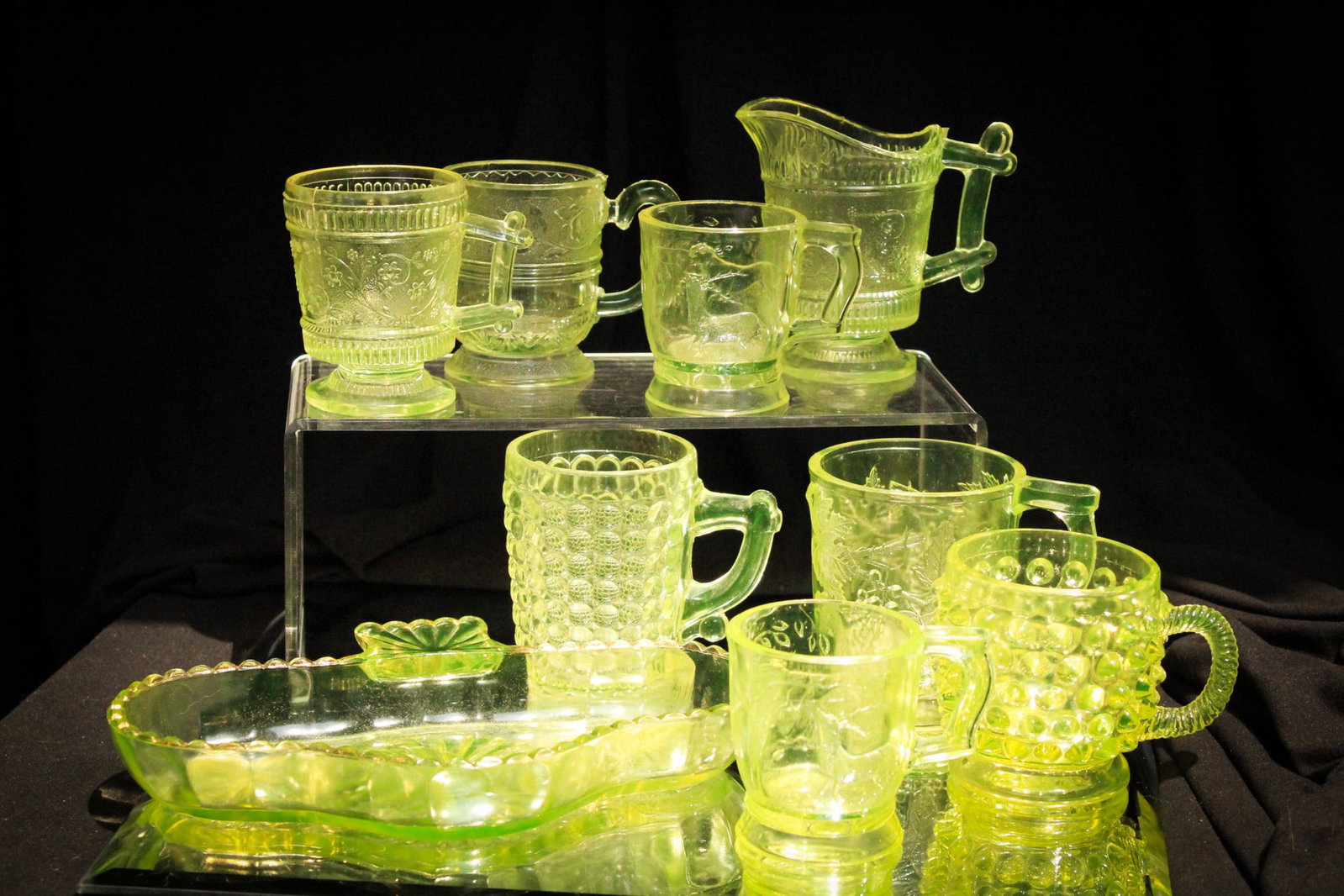9 pc Lot Victorian Vaseline EAPG Riverside Tray & Mugs: Only the best at Magnum Auctions folks! Hard to find Riverside Victorian vaseline glass tray along with 8 mugs.