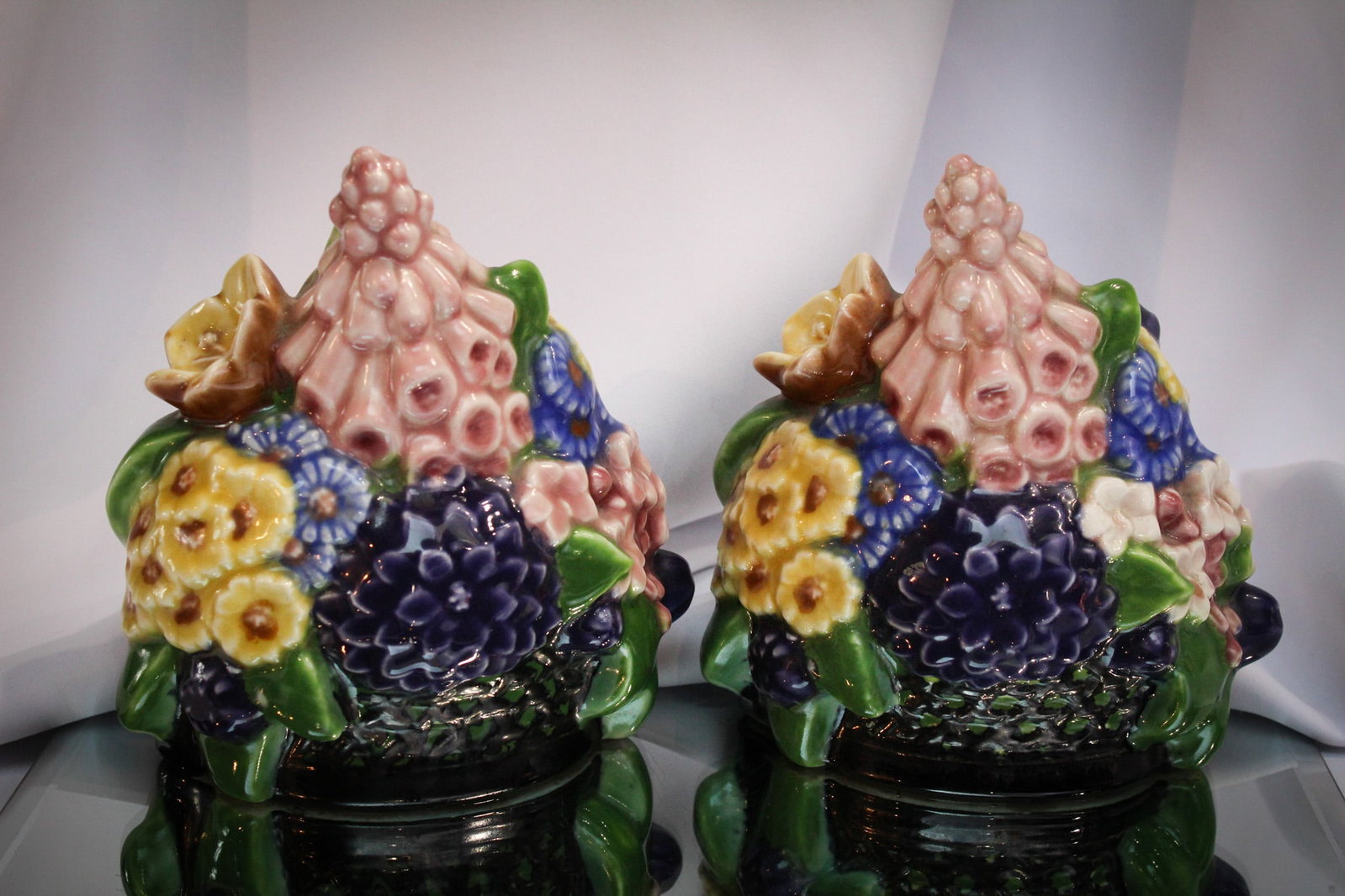 Rookwood Pair of Flower Bookends XXVII: Super pair of Rookwood pottery bookends in the form of bouquets of flowers. Marked as shown. Brilliant colors to these great examples.