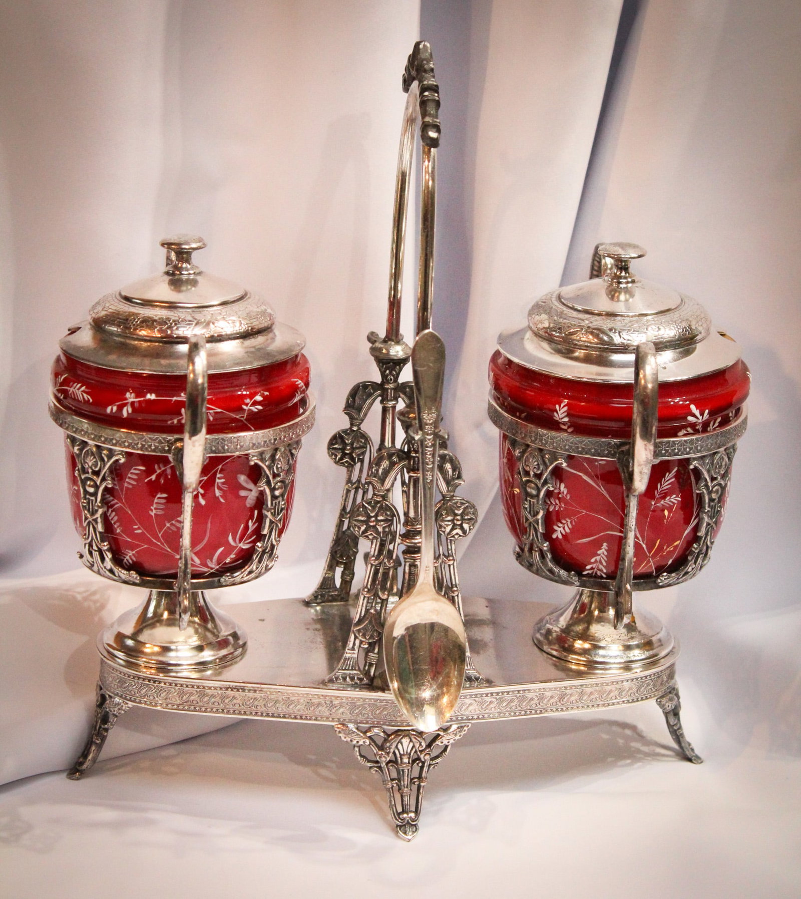 Fantastic Reed & Barton Cased Enameled Glass Double Castor: Folks stand up and take notice of this fantastic piece. Two completely removable jars residing in original silverplate signed "Reed & Barton" frame. Each jar has orignal cranberry enameled cased glass