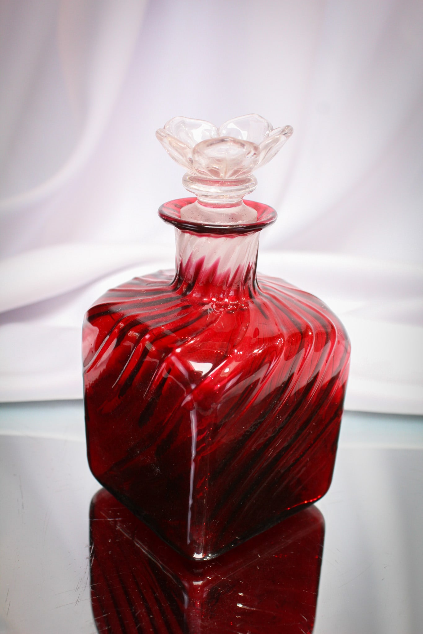 Steuben Glass Selenium Red Cologne Bottle Flower Stopper: Signed as shown Steuben Selenium Red cologne bottle complete with flower form stopper. Great example with super coloring.