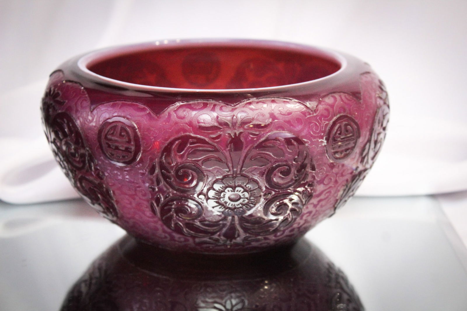 Steuben Glass Plum Jade Acid Cut Back Bowl: Deep rich color encompasses this Steuben Plum Jade acid cut back example bowl. Exquiisite! Piece measures 4" by 7 3/4".