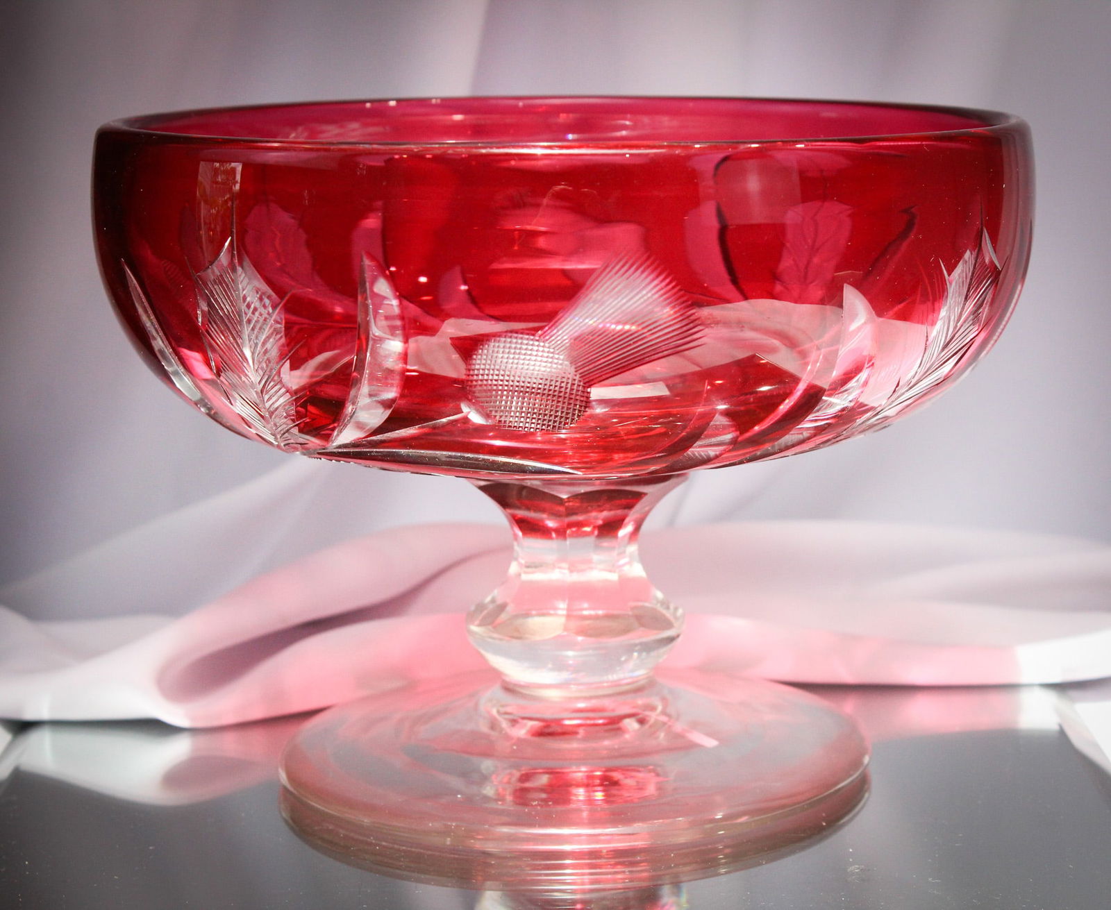 Signed Steuben Glass #6245 Gold Ruby Cut Centerpiece Pedestal Bowl: Fantastick signed Steuben #6245 Ruby Gold thistle engraved centerpiece bowl on pedestal. Marvelous showy piece with lots of detail. Measures 7 1/2" tall, 10" in diameter.