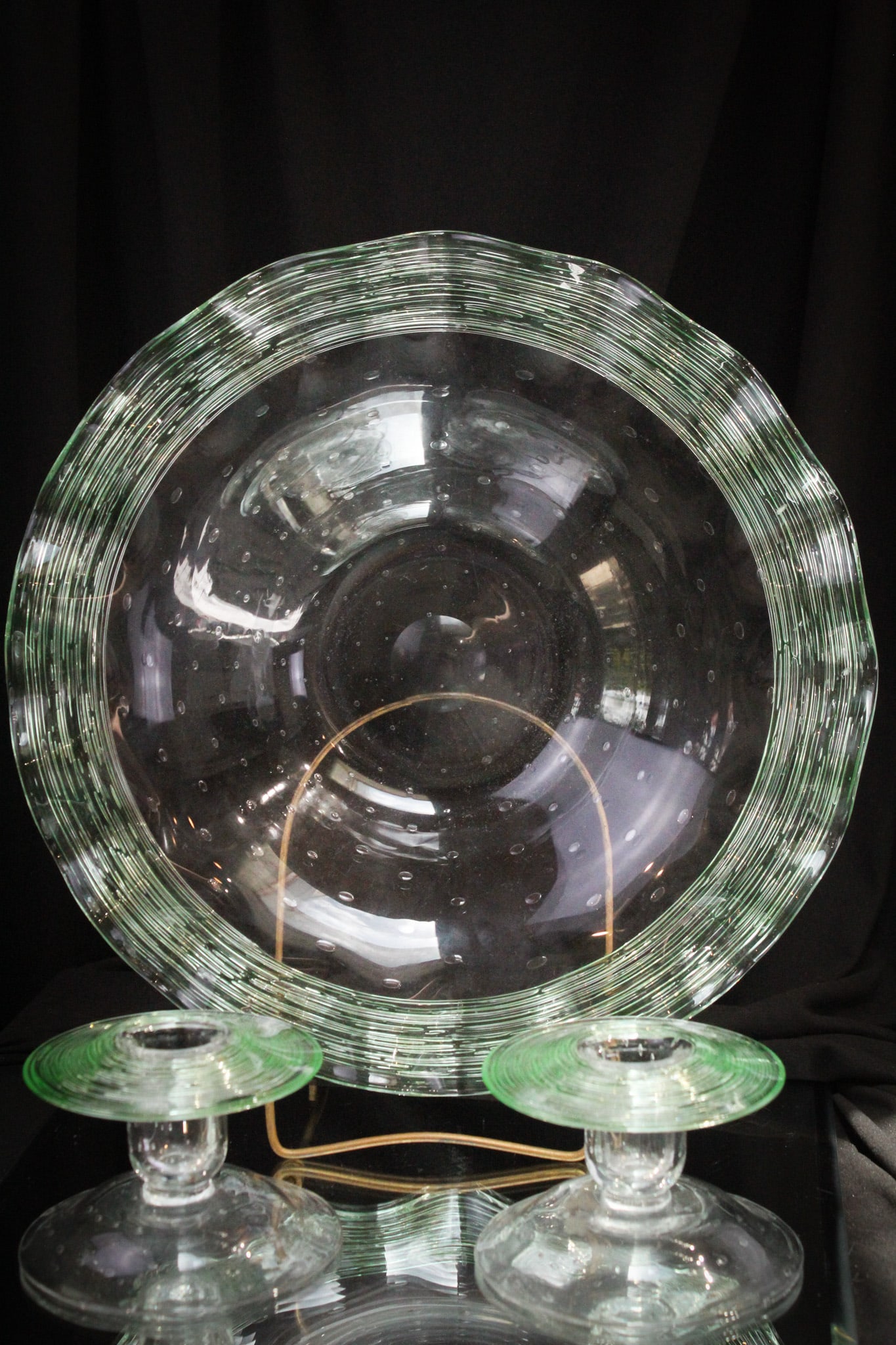 3 pc Fry Uranium Green Console Set Centerpiece Bowl & Candlesticks: Great offering of a Fry glass three piece console set with uranium content green threading. Threading glows brilliantly under black light. Largest measures 3" tall, 13 1/2" in diameter.