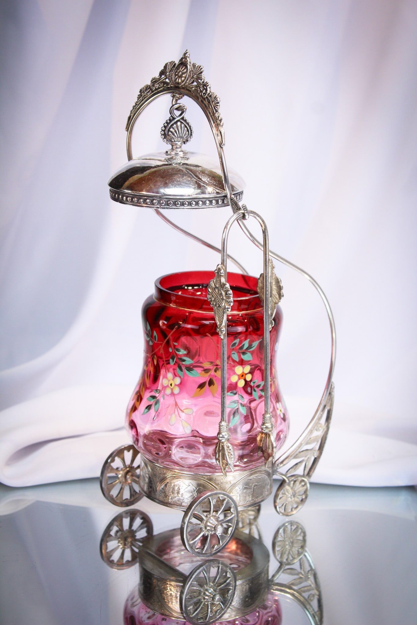 Rare Rogers Silverplate Wheeled Cranberry Rubina Enamaled Victorian Pickle Castor: One amazing pickle castor. Frame is signed "Rogers" silverplate and features moving wheels in the front. Jar is deep rich cranberry rubina with a large amount of florals enameled around. Jar is comple