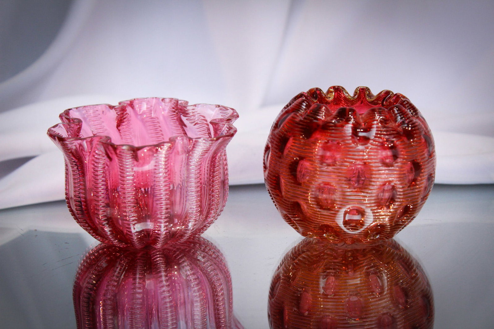 2 pc Lot Stevens & Williams Jewel Airtrap Rose Bowls: Great offering of two fine little pieces of Stevens & Williams "Jewel" pattern airtrap glass. Two unique forms and color. Each marked with registry number.
