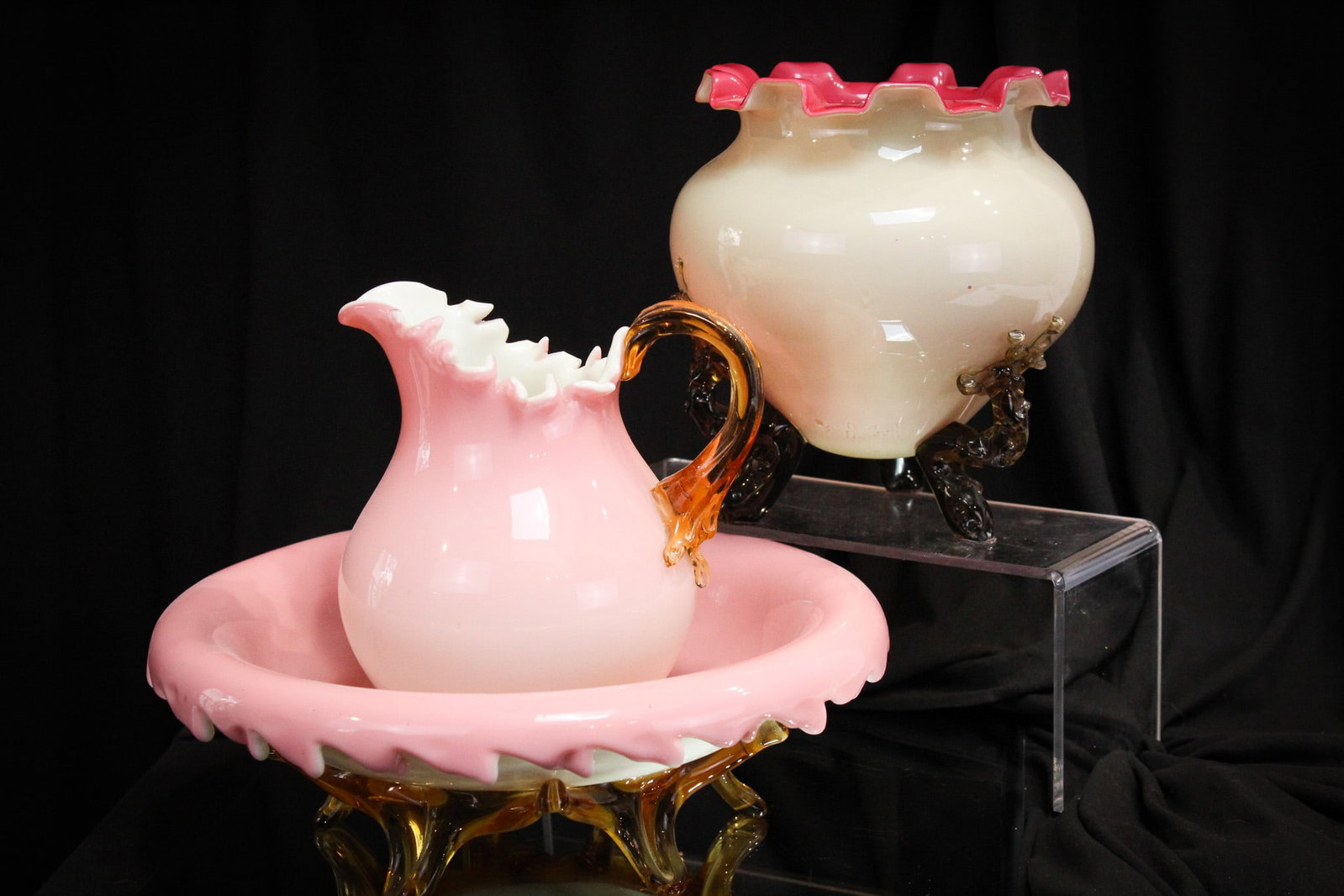 Victorian Stevens Williams Cased Applied Glass Pitcher w/Bowl & More: Select offering here of an attributed to Stevens & Williams pitcher & bowl set in cased glass with applied amber handle and feet. Nice cut treatment to rims. This along with a similar vase.