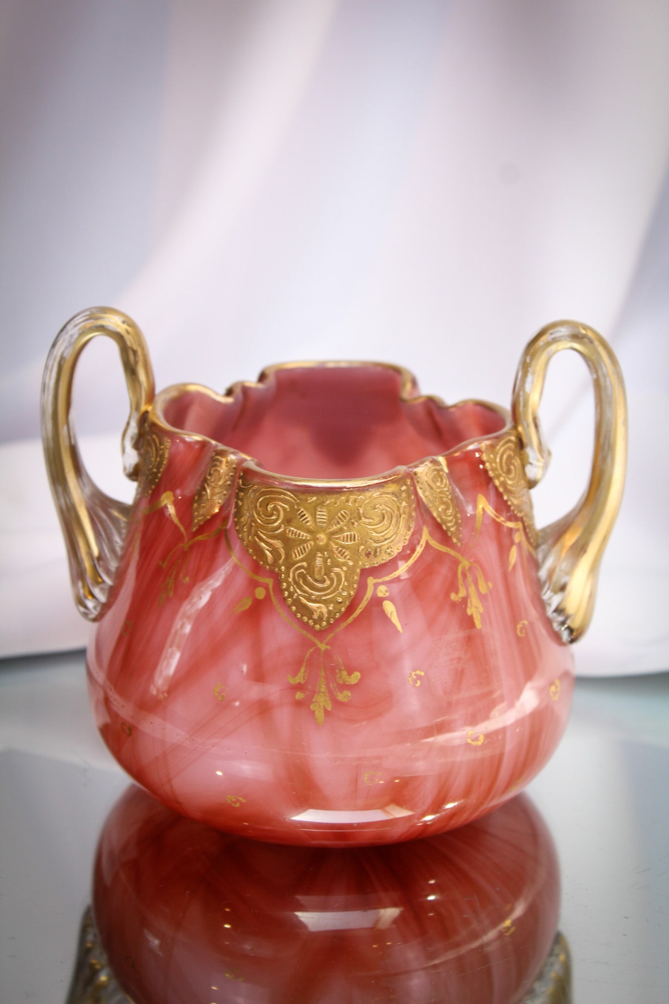 Loetz Marmoriertes Carneol Double Handle Vase: Fine example in a diminutive size. This piece of Loetz has the addition of applied gilt handles and lovely decoration. Fine piece.