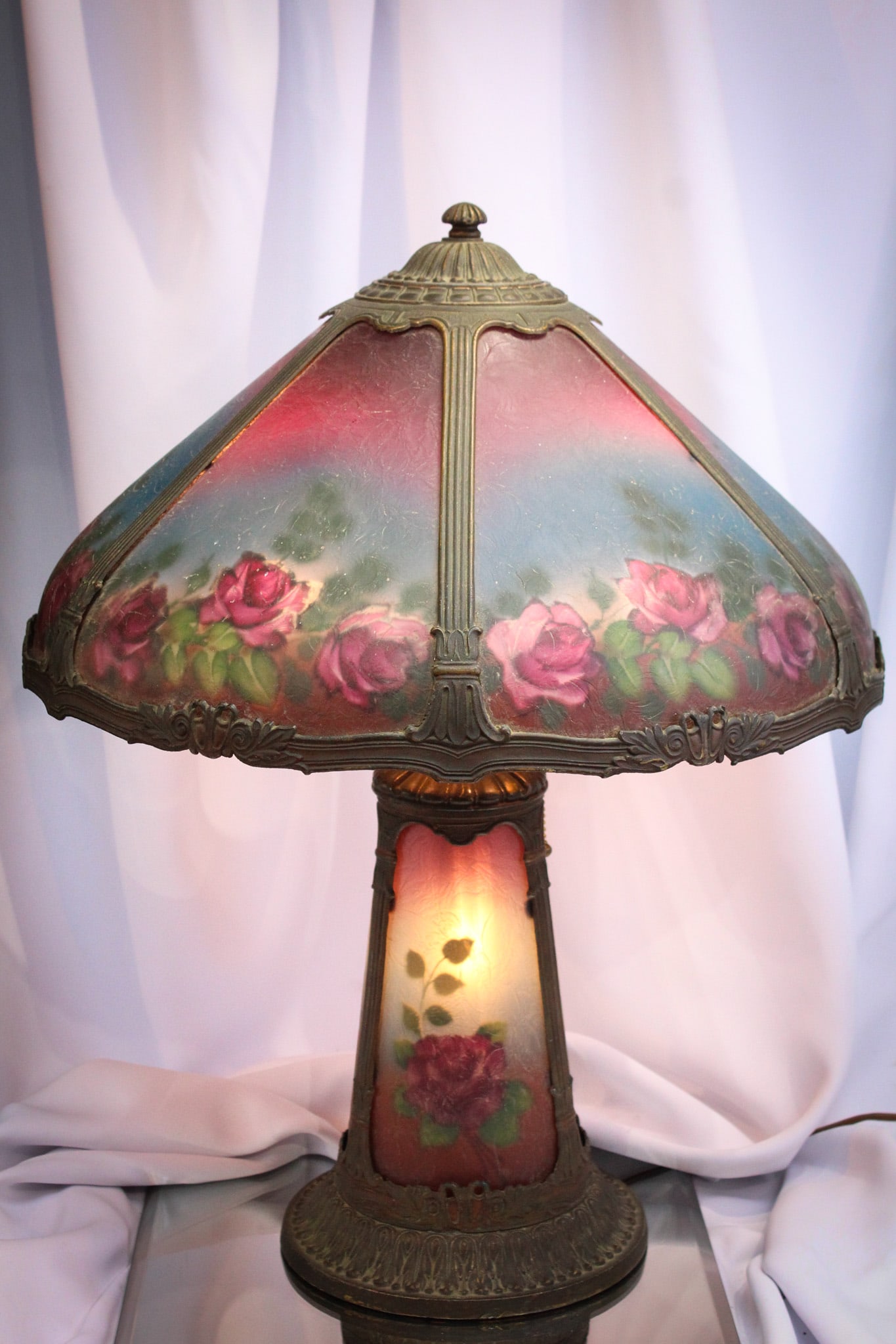 Antique Reverse Painted Purple & Blue Panel Lamp: Gorgeous example with vibrant colors is this reverse painted panel lamp complete with light up base. Extraordinary colorful lamp in complete original patina condition. Not many like this one around. S