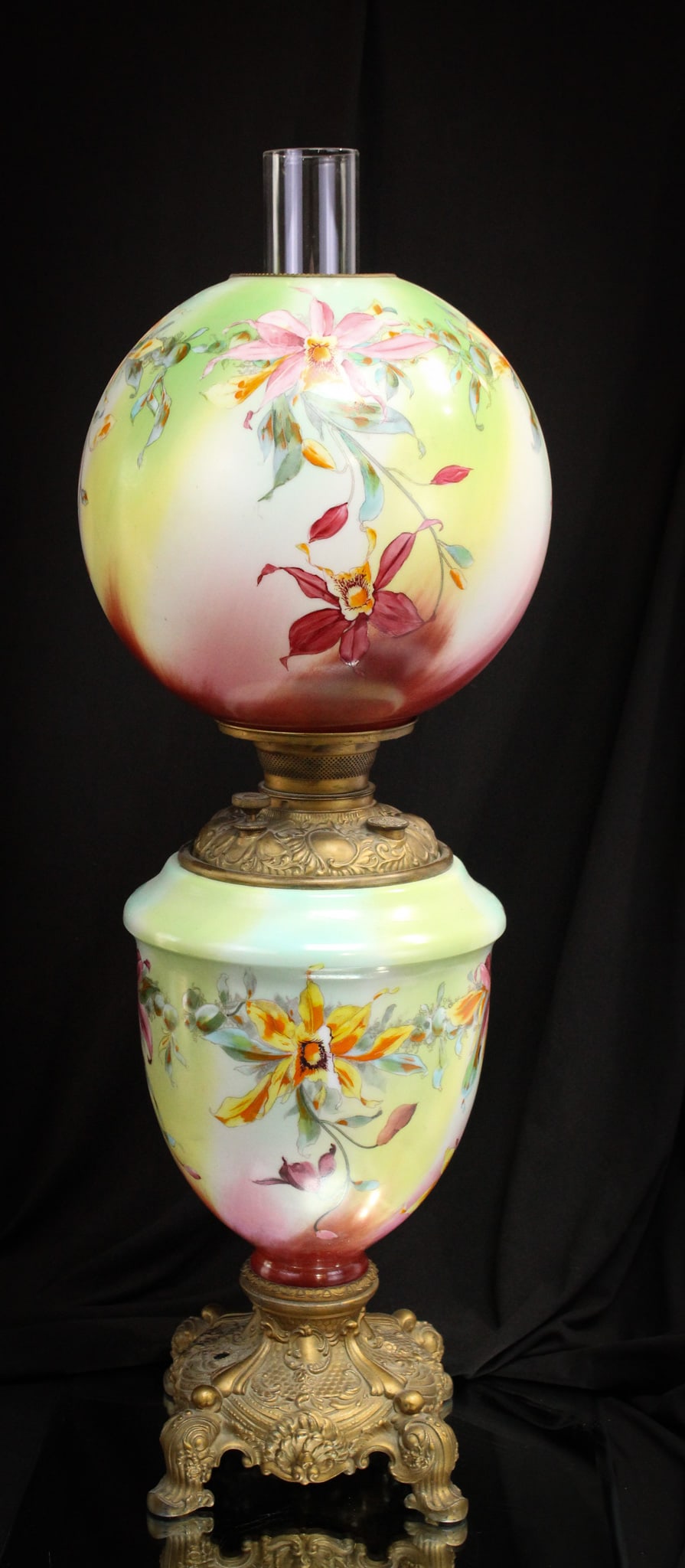 Victorian Banquet Parlor Oil Gone with the Wind Lamp Orchids: Beautiful orchids decorate this desirable Victorian Gone with the Wind parlor oil lamp. Clean example with vibrant colors. Complete on ornate base.