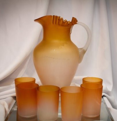 7 pc Victorian Phoenix Glass Ribbed water Set: Great complete water set attributed to Phoenix glass in a great orange coloring. Glass has satin finish and a fine rib texture. Pitcher and six tumblers all to go!