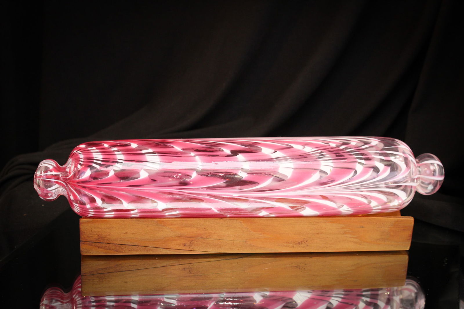 Pink & White Marbrie Loop Victorian Glass Rolling Pin: Super example of an art glass rolling pin in "Marbrie Loop" pattern with pink and white looping. Comes compplete with wooden stand. Measures 12" long.