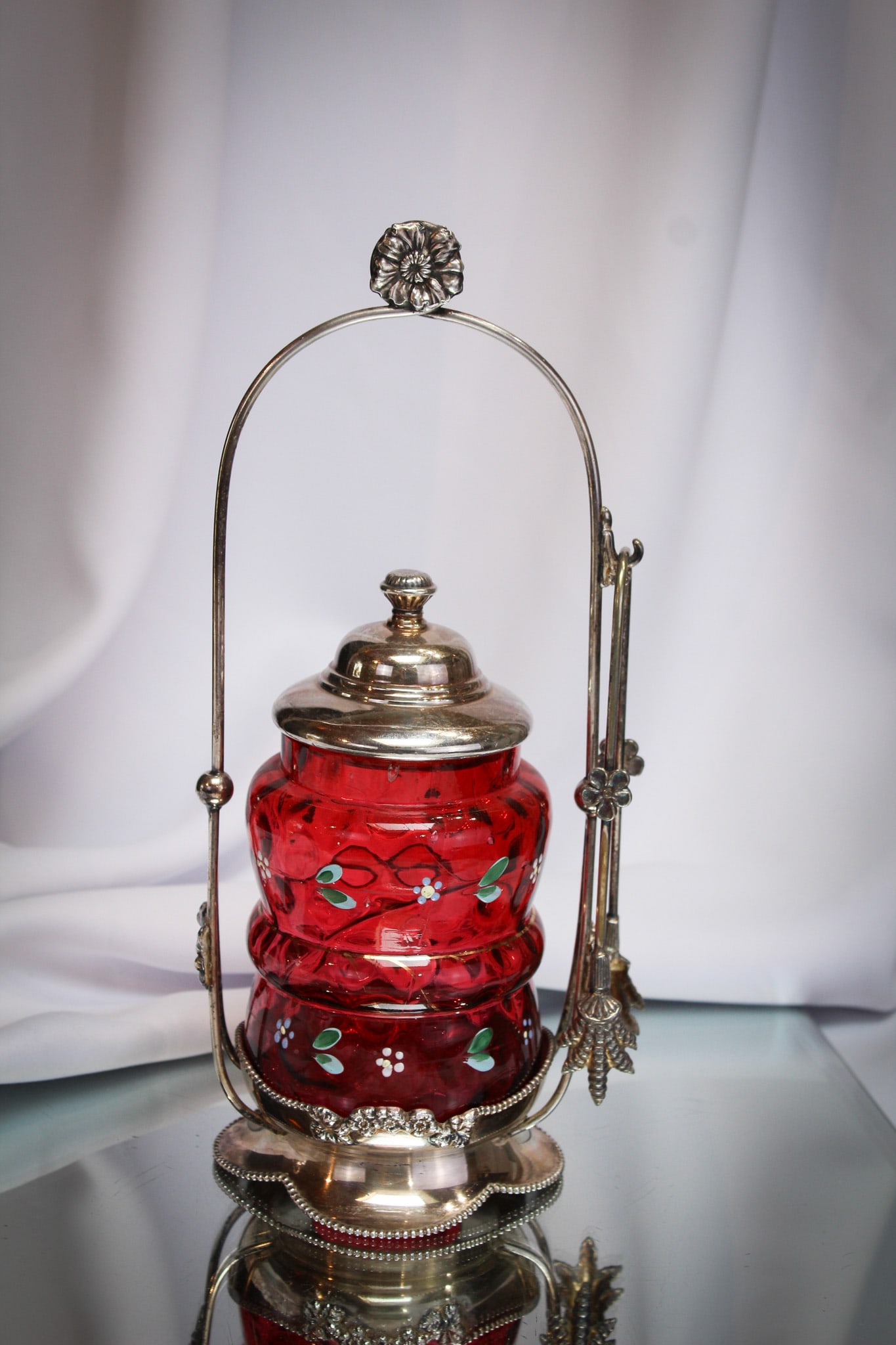 Pairpoint Silverplate Cranberry Victorian Enameled Pickle Castor: A real gem here! This lovely signed "Pairpoint" silverplate frame is graced with the addition of a deep rich cranberry floral decorated jar. Very nice!