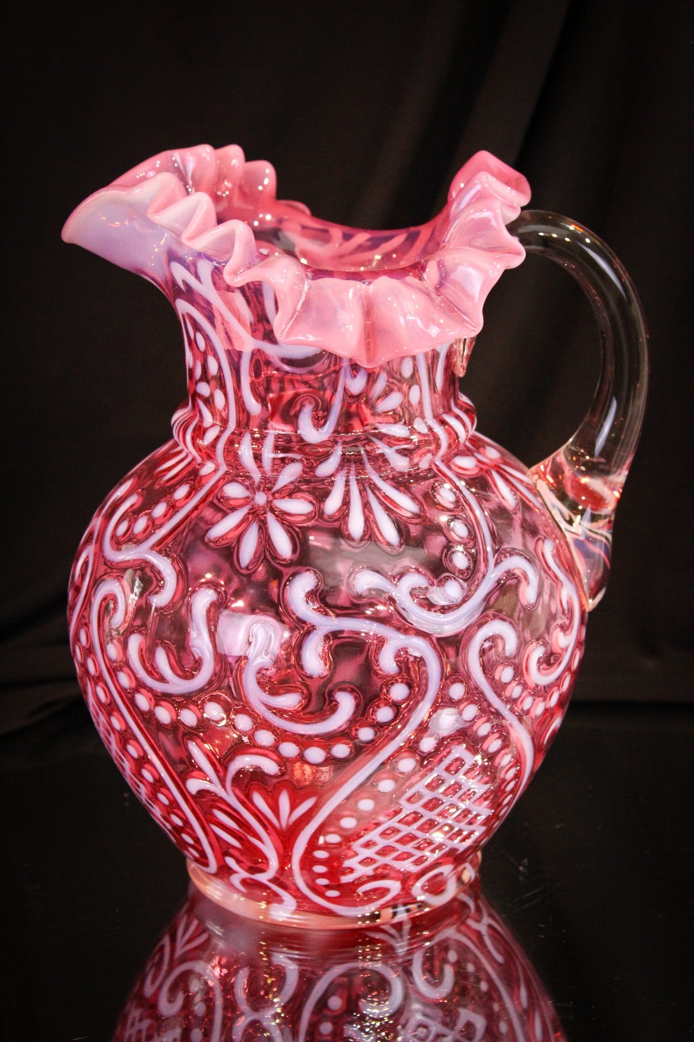 Northwood Cranberry Opalescent Arabian Nights Water Pitcher: Fine example of Northwood's Arabian Nights pattern water pitcher. This one has super cranberry color and crisp white opalescence. The best of show here, folks!