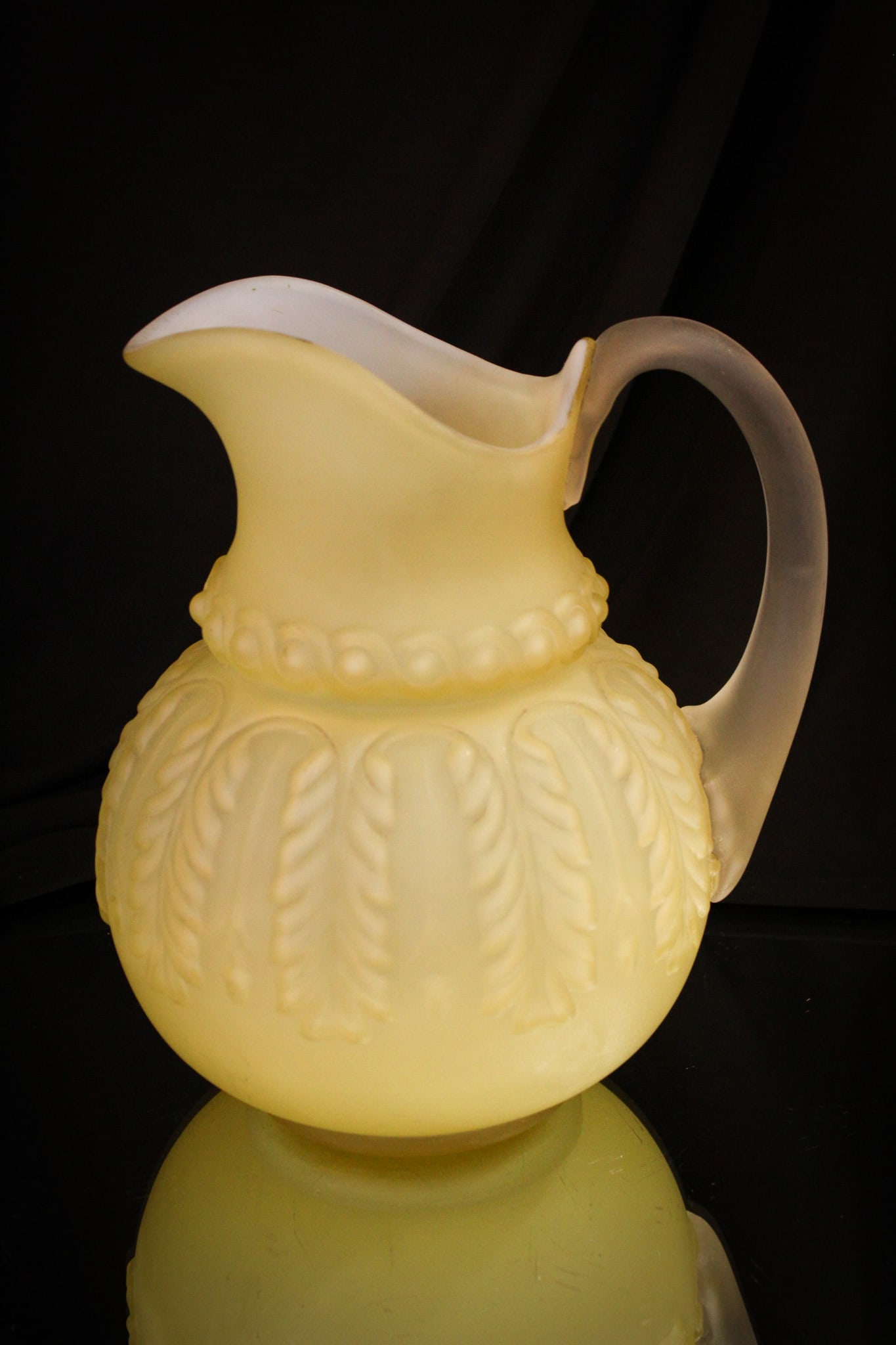 Northwood Leaf Umbrella Satin Victorian Water Pitcher: Rich satin finish envelops this Victorian Northwood Leaf Umbrella pattern pitcher. Silky smooth to the touch and nice soft lemon coloring makes this a want-to-have piece.