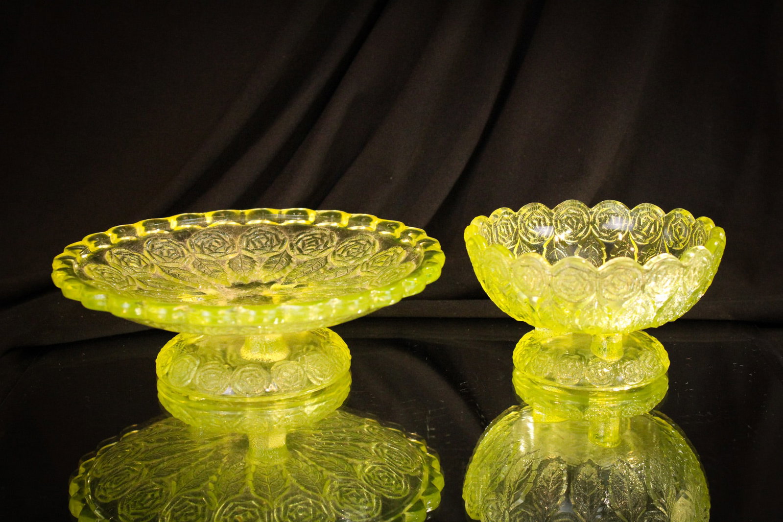 2 pc Lot Victorian Vaseline Greentown Rose Garland Glass: Two examples of Greentown glass in the Rose Garland pattern. A berry Bowl and footed tray. Tallest measures 2 1/2".