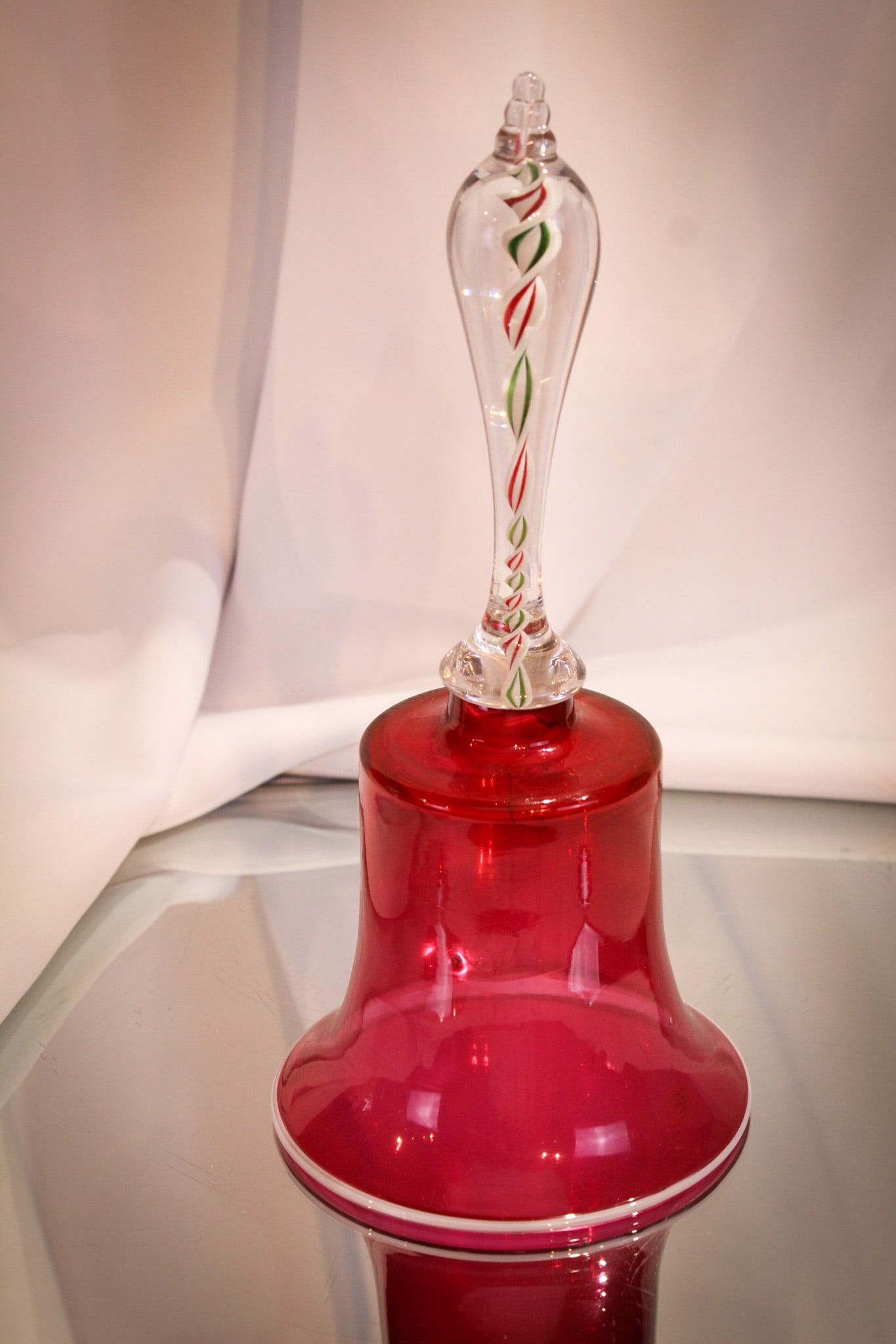 Victorian 10 1/2" Cranberry & Latticino Glass Wedding Bell: Gorgeous cranberry blown glass wedding bell measuring a stout 10 1/2" tall complete with latticino art glass handle. Fine piece.